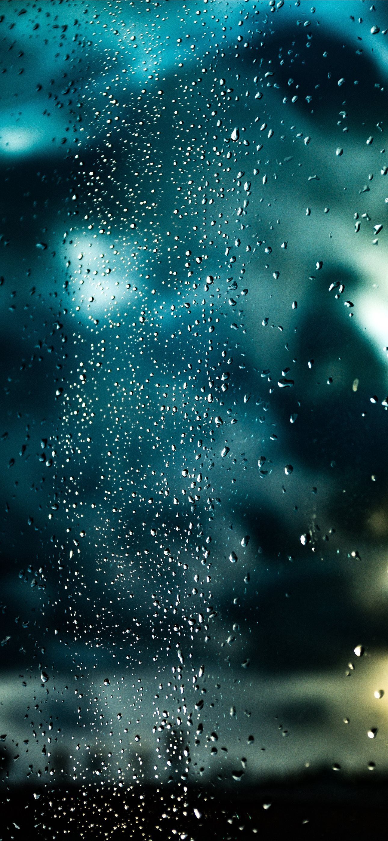 1290x2796 a window with rain drops on the glass iPhone Wallpaper Free Download