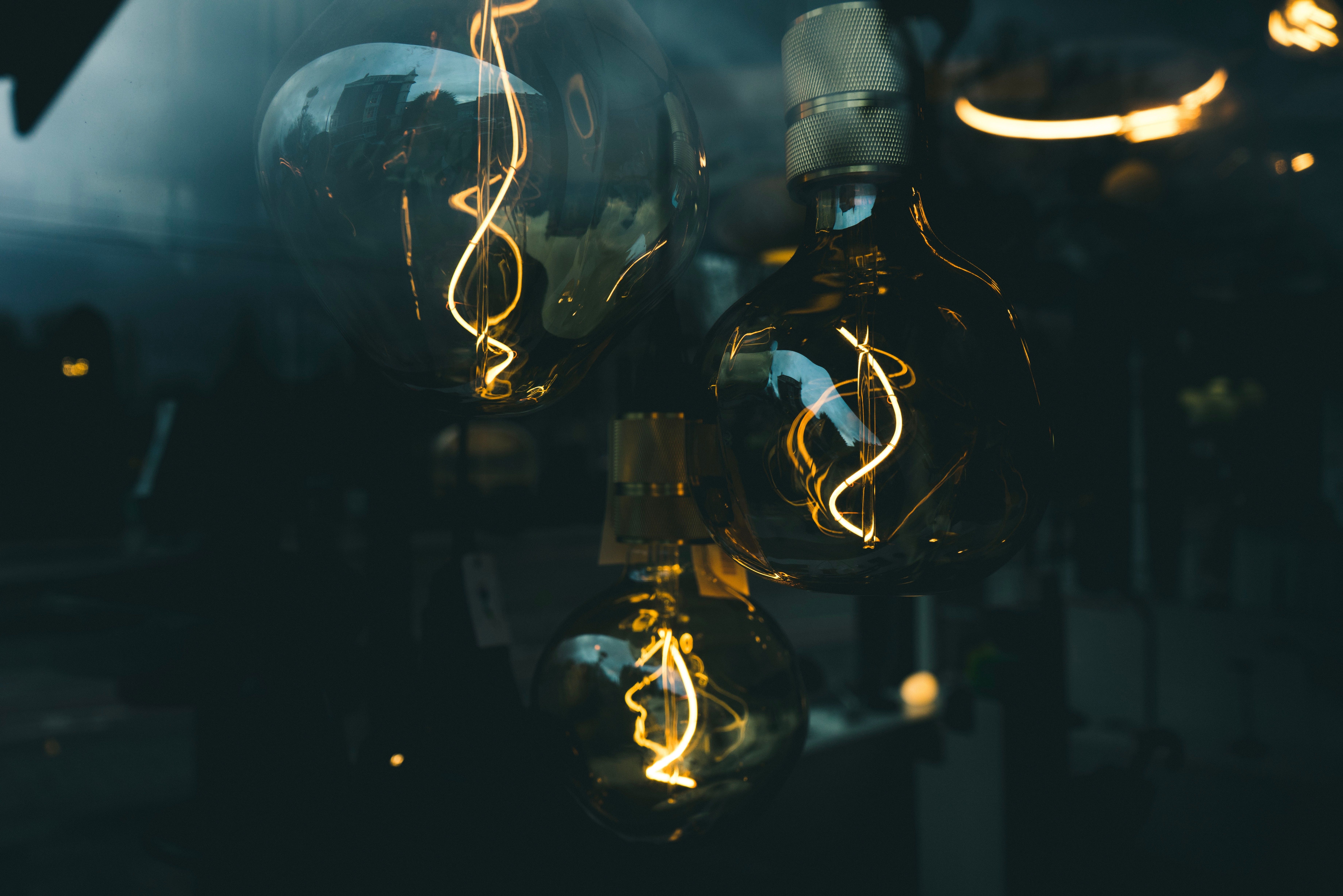 7360x4912 Wallpaper Clear Glass Light Bulb Turned on in Dim Light, Background Free Image