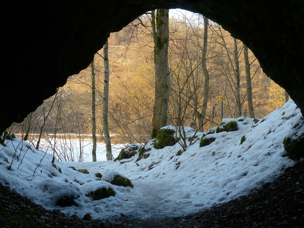 1024x768 A view of a snow covered forest from inside a cave. Cave cave entrance caves portal. Domain Media Search Engine Public Domain Search