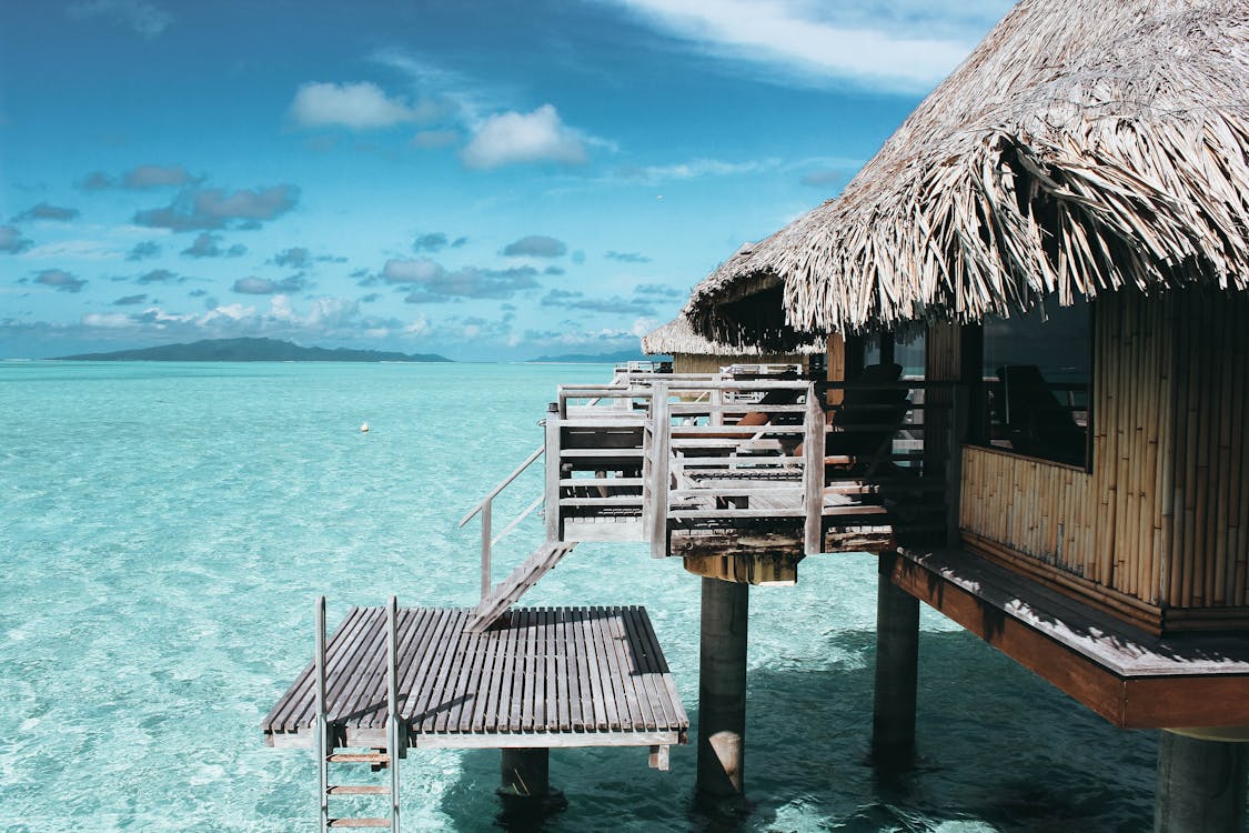 1125x750 Brown Nipa Hut on Body of Water · Free