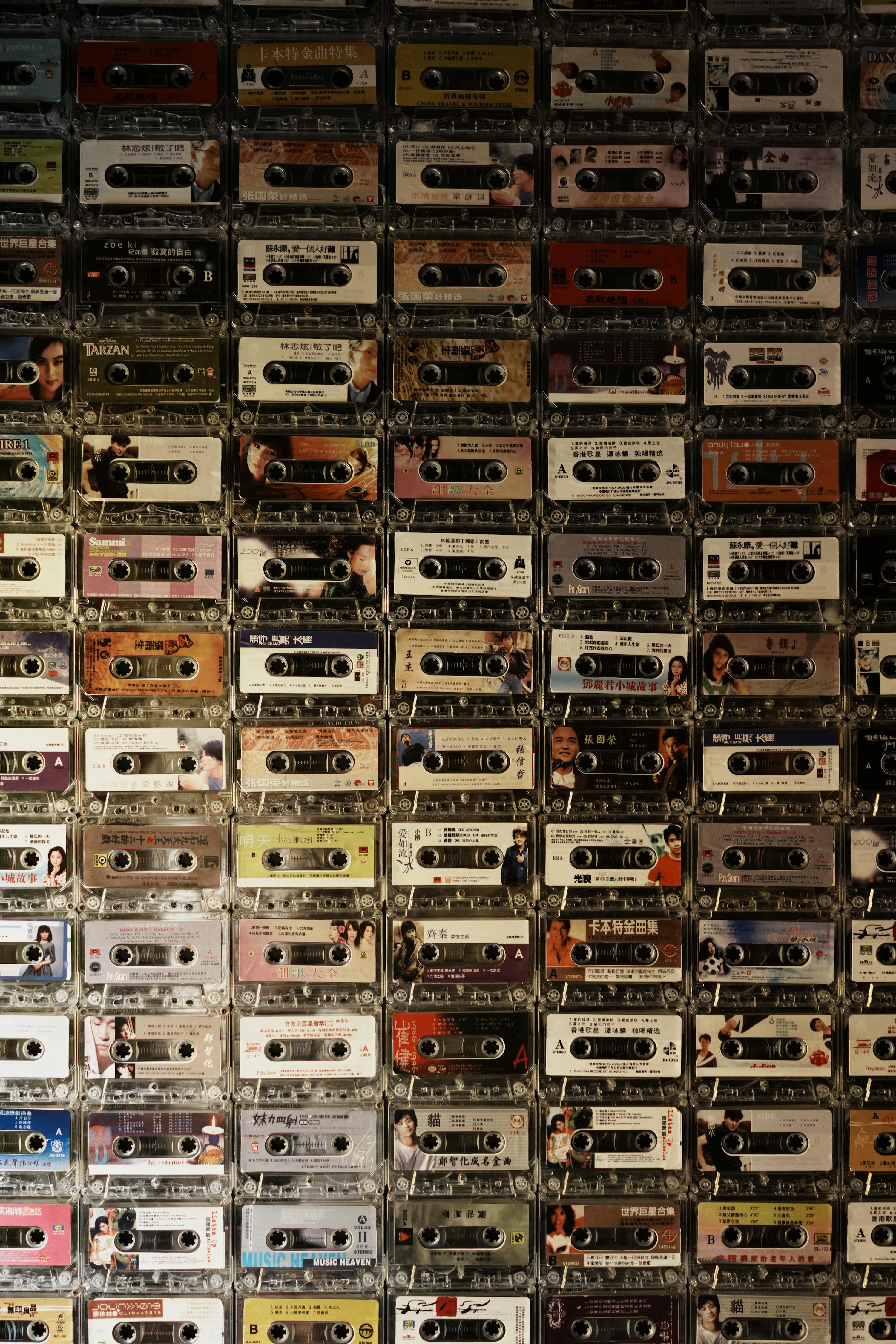 3000x4500 Wall covered with many vintage cassette tapes photo