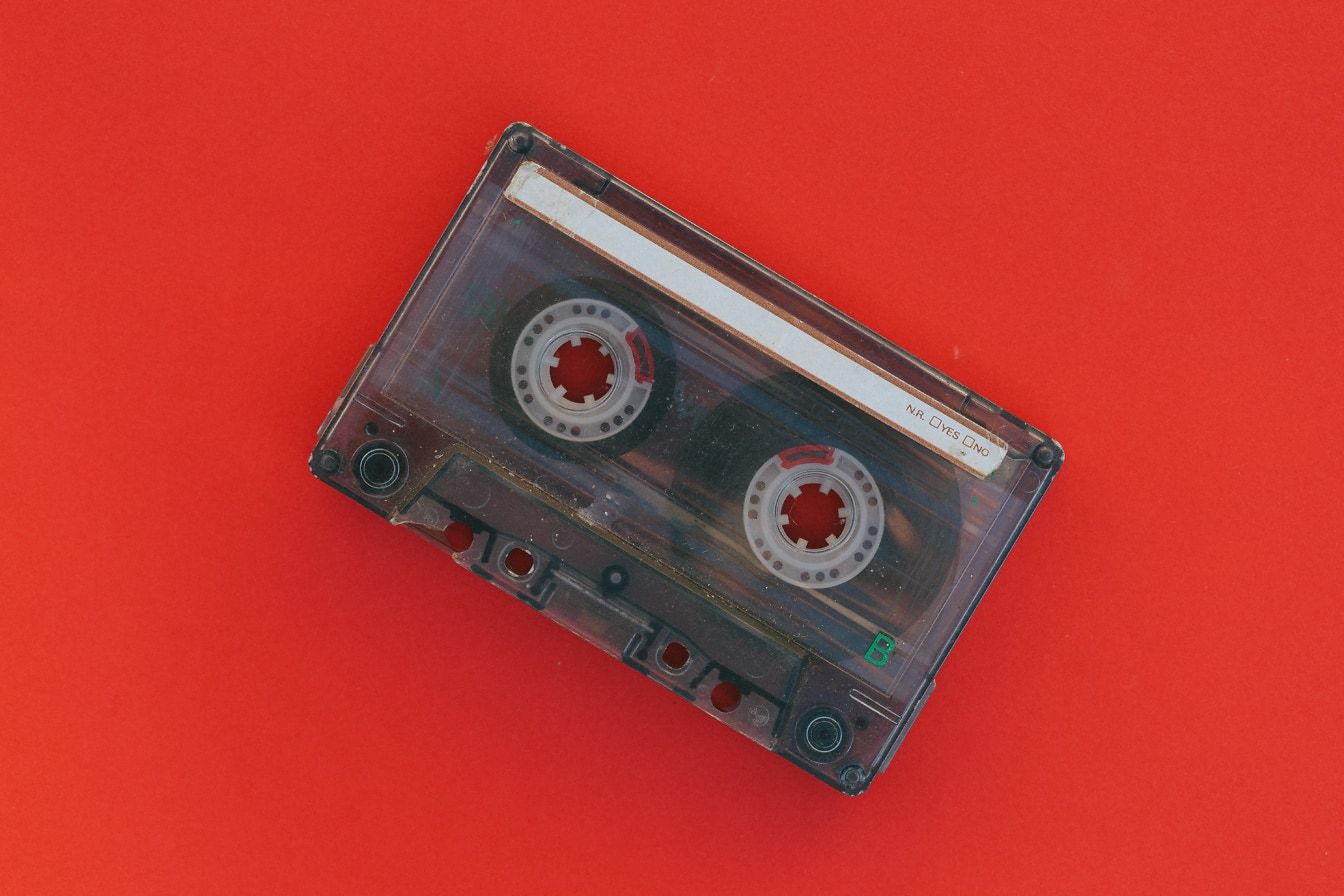 1344x896 Free picture: Old music cassette tape on a red background