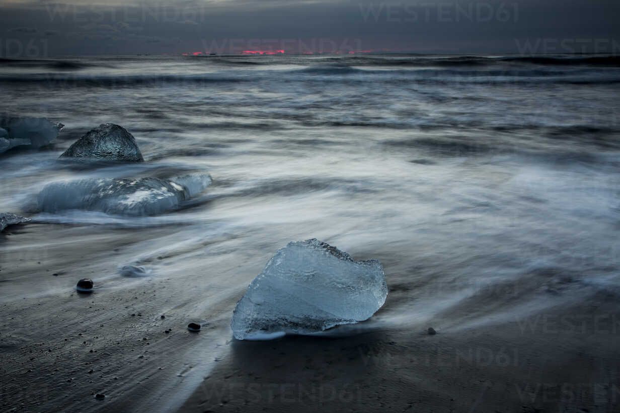 1232x821 Ice on stormy cold ocean beach, Iceland