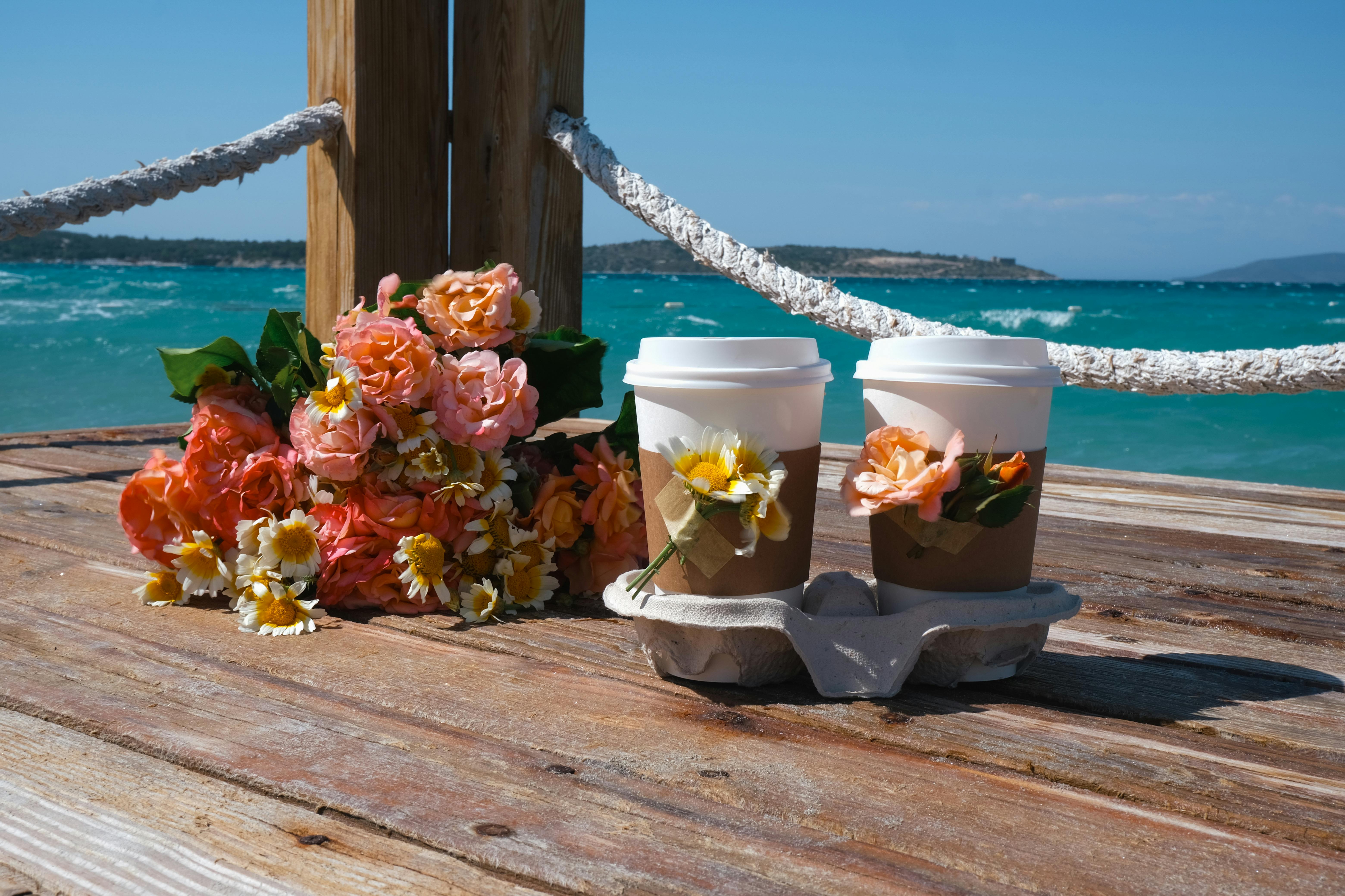 6240x4160 Coffee in Disposable Cups and a Bouquet of Flowers · Free