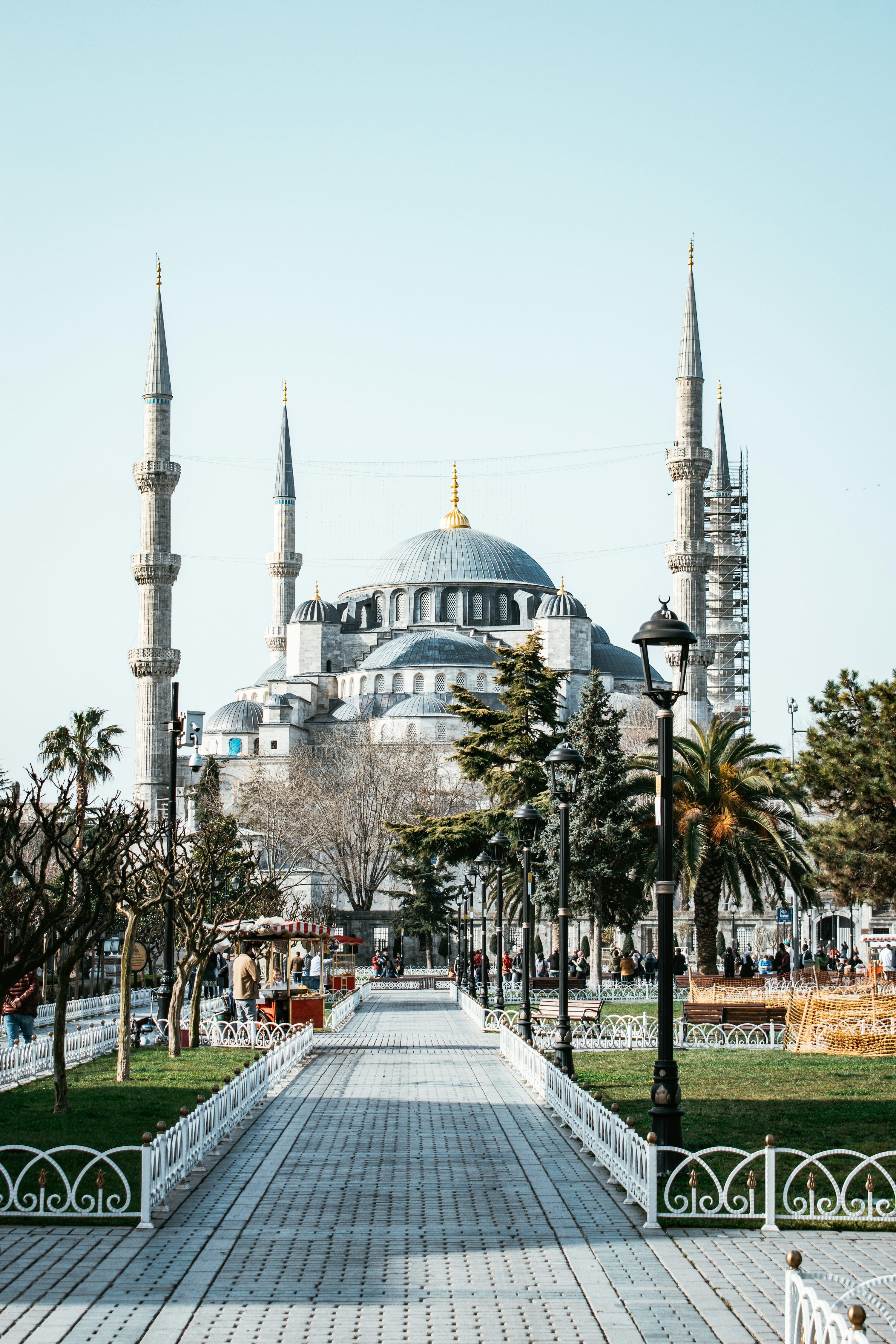 3000x4500 A walkway leading to a large building with many spires photo
