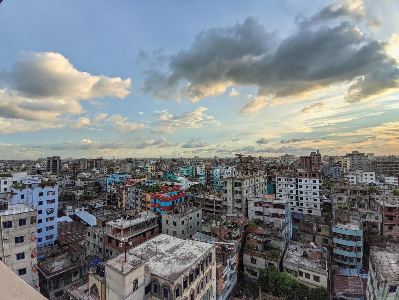 1305x980 City view from the building roof in Dhaka, Bangladesh. Beautiful Sunset, blue cloudy sky