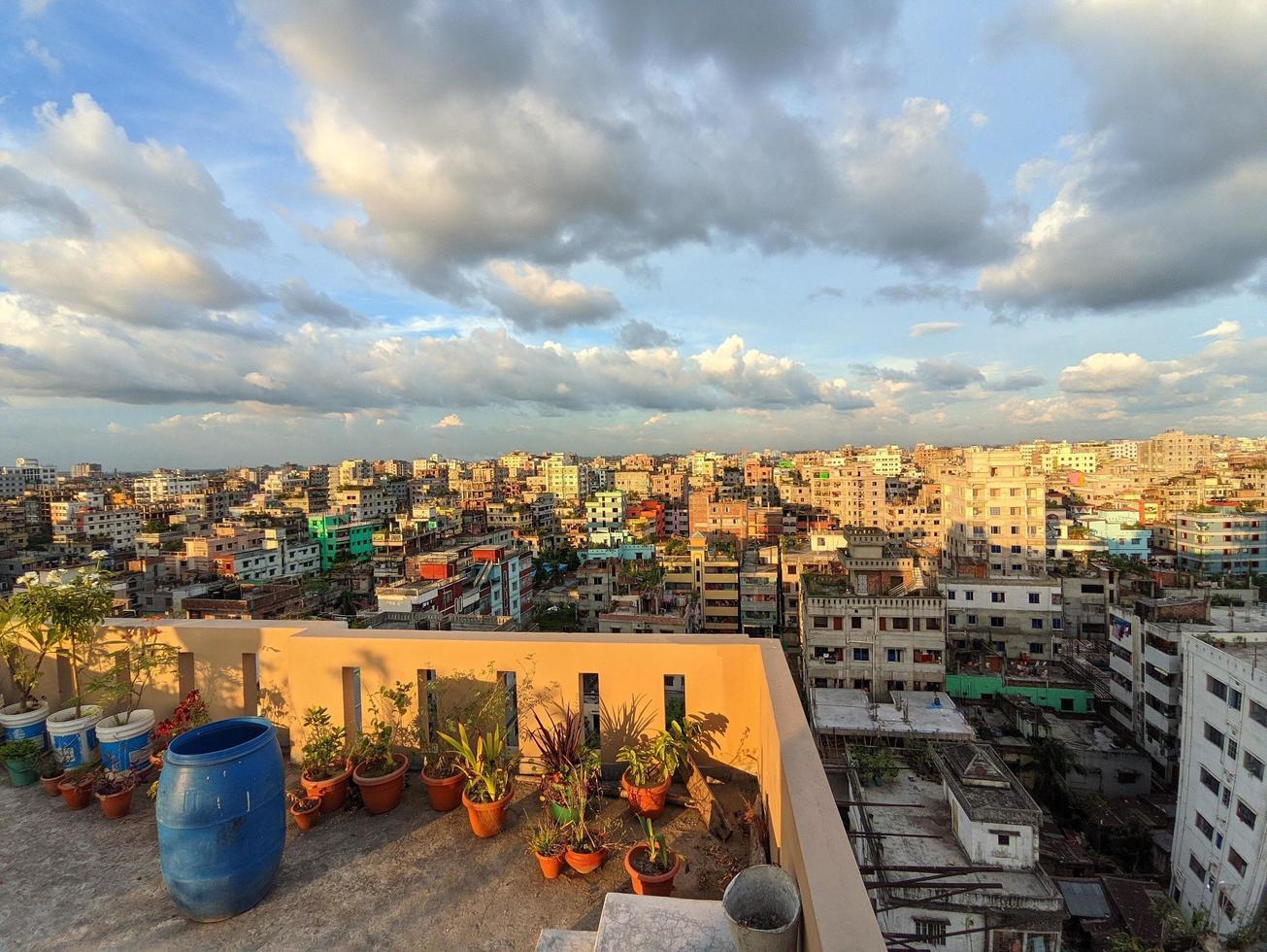1305x980 City view from the building roof in Dhaka, Bangladesh. Beautiful Sunset, blue cloudy sky