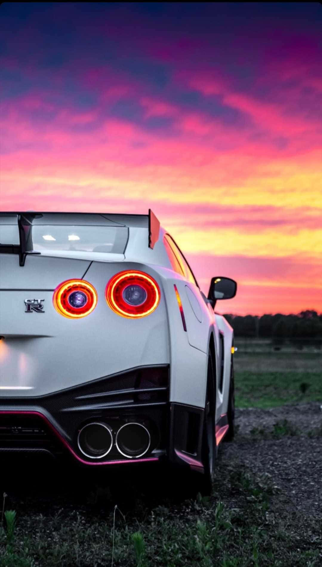 1079x1899 Download Nissan GTR: A Powerful Driving Machine Wallpaper