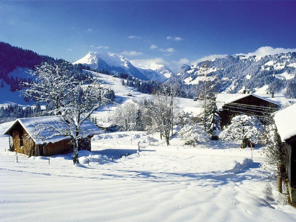 1024x768 Skiing Gstaad, Switzerland resort information, guide review / Ski Trips, Vacations & Snowboarding