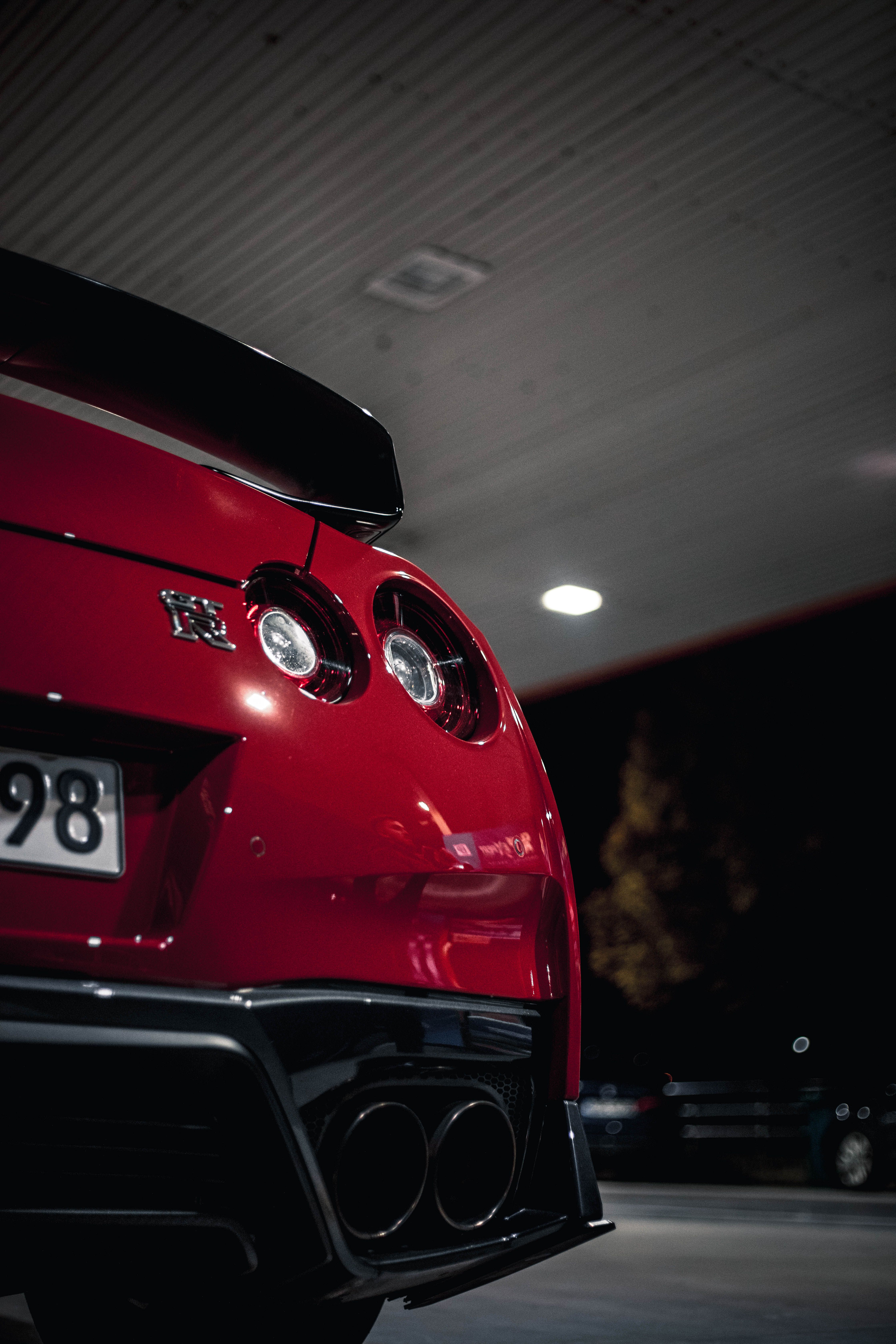 4480x6720 Red Nissan GT R At Nighttime Gas Station · Free
