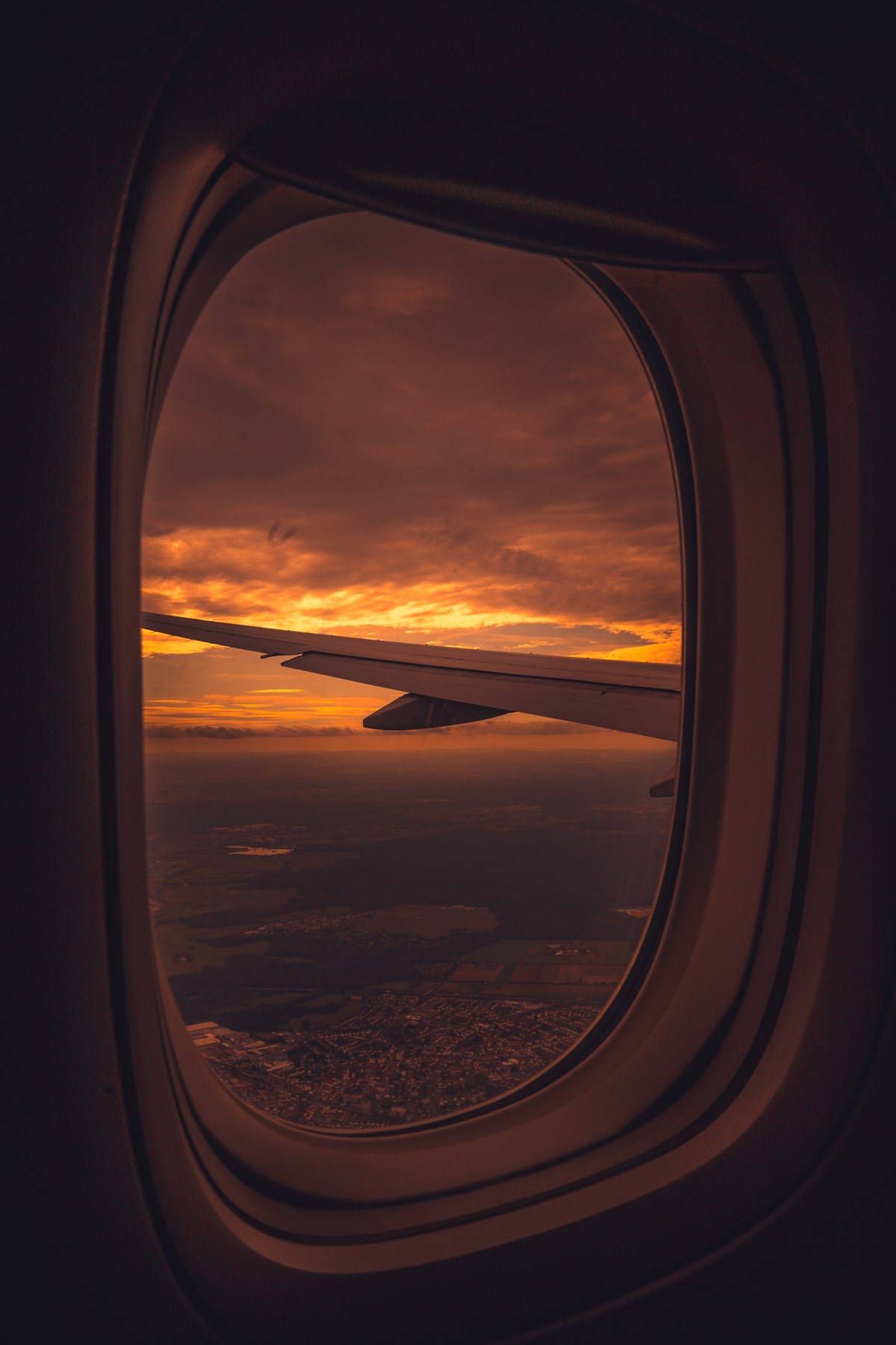 1200x1800 Download Airplane Window Red Sunset Sky Wallpaper