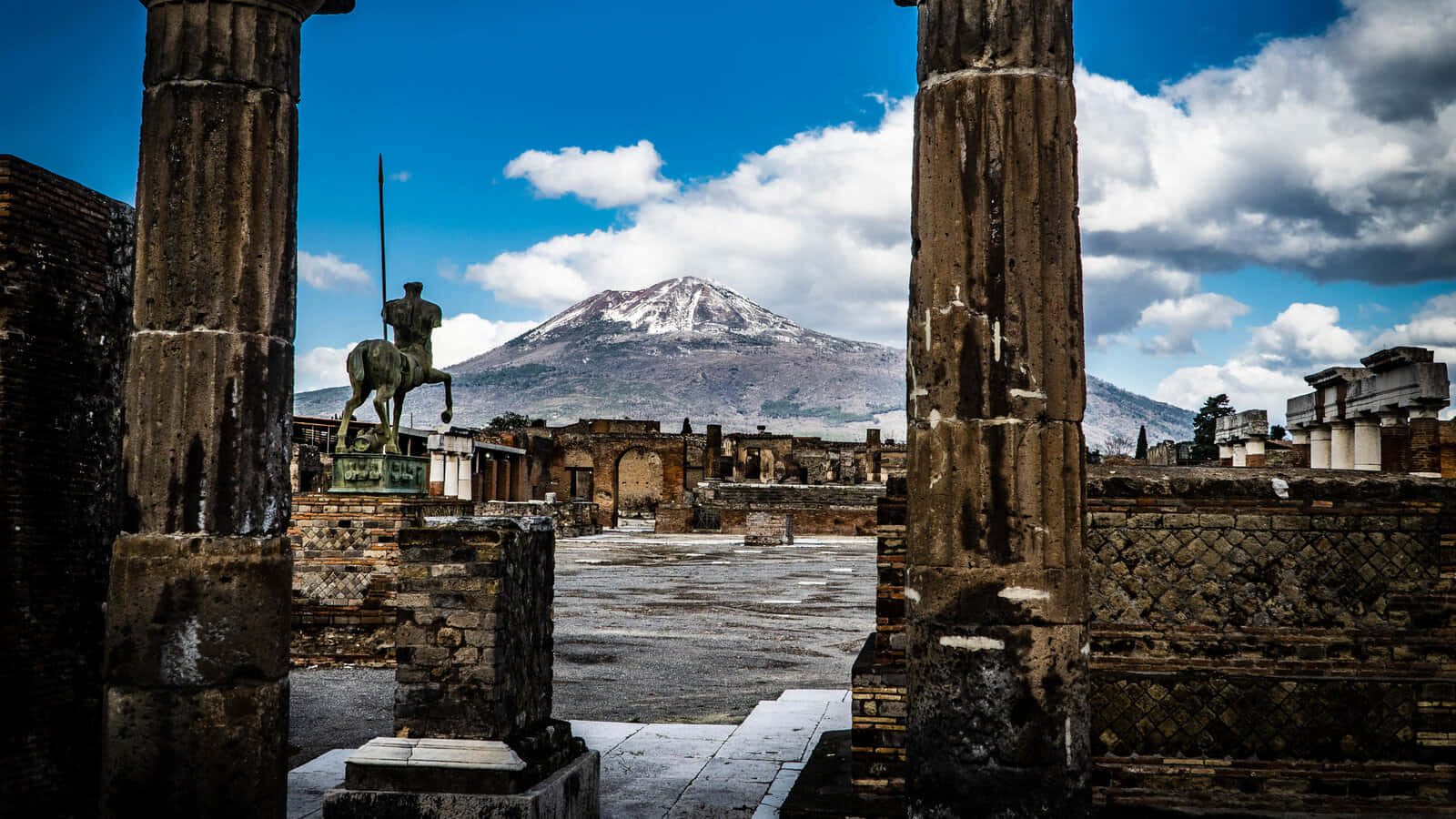 1600x900 Download Beautiful Pompeii Ruins And Snowy Mount Vesuvius Wallpaper