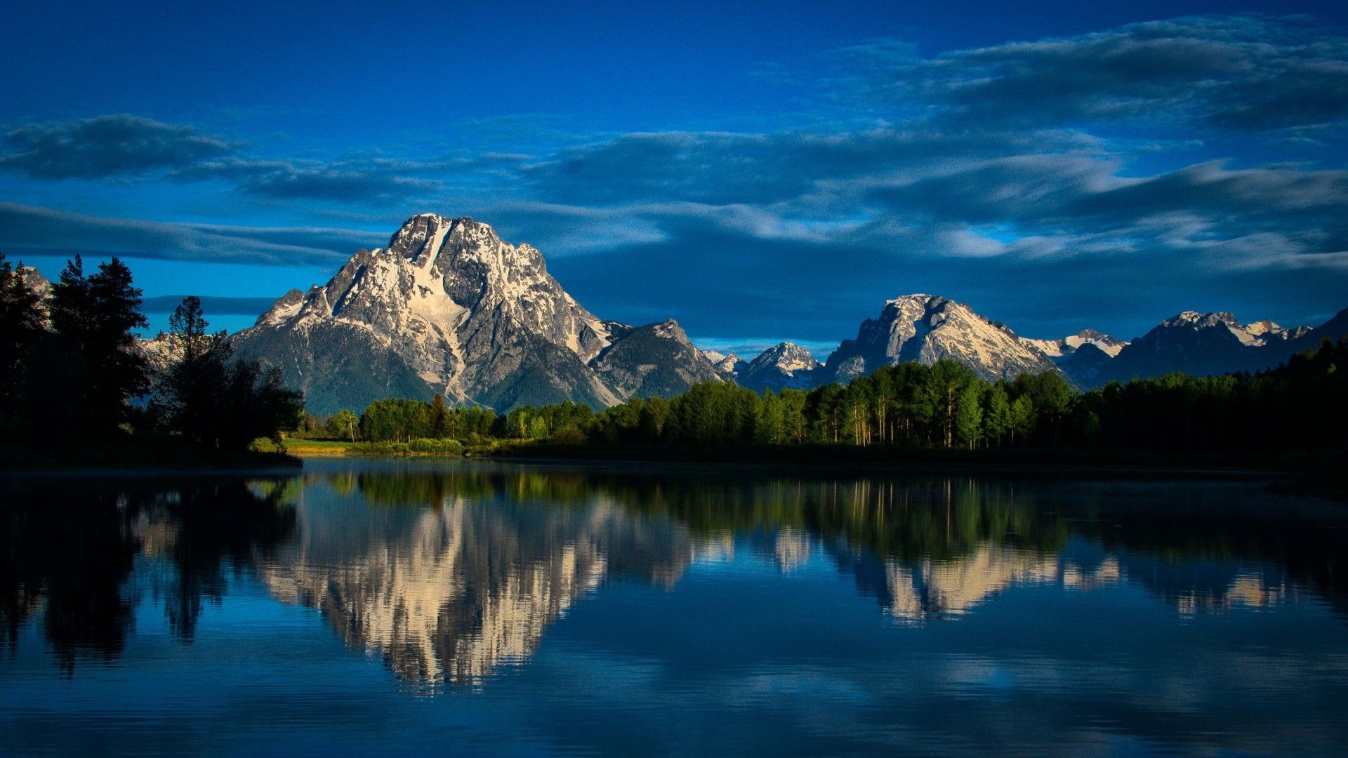 1920x1080 Beautiful Scenery Landscape View Of Rocks Mountains Green Trees Forest Reflection On Water Under Blue Clouds Sky 4K HD Nature Wallpaper