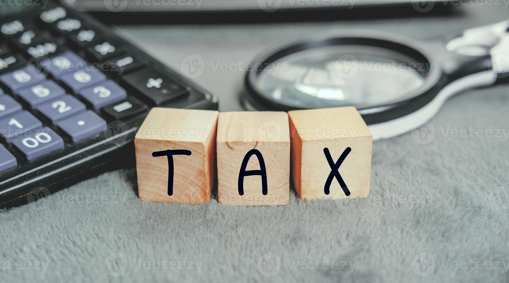 1761x980 Concept of taxes paid by individuals and corporations such as VAT, income tax and property tax Data analysis, paperwork, Financial research, TAX on block cubes