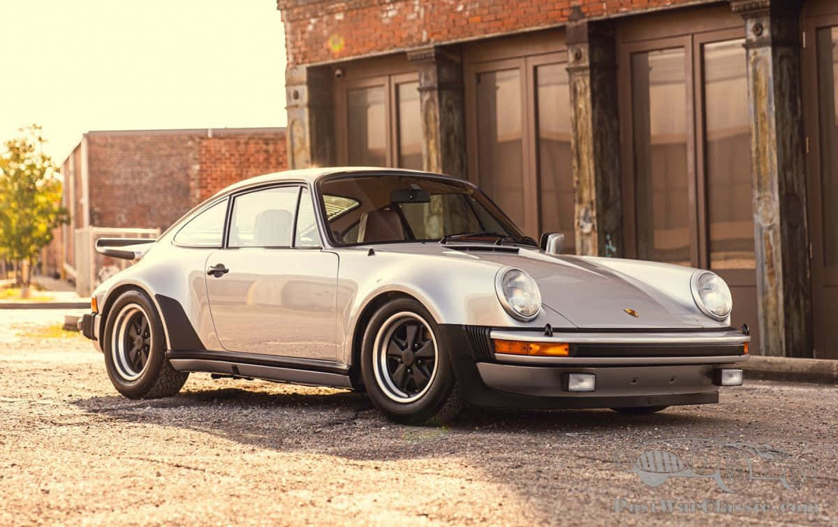 1200x755 Download Dynamic Porsche 930 Showcasing Its High Speed Prowess. Wallpaper