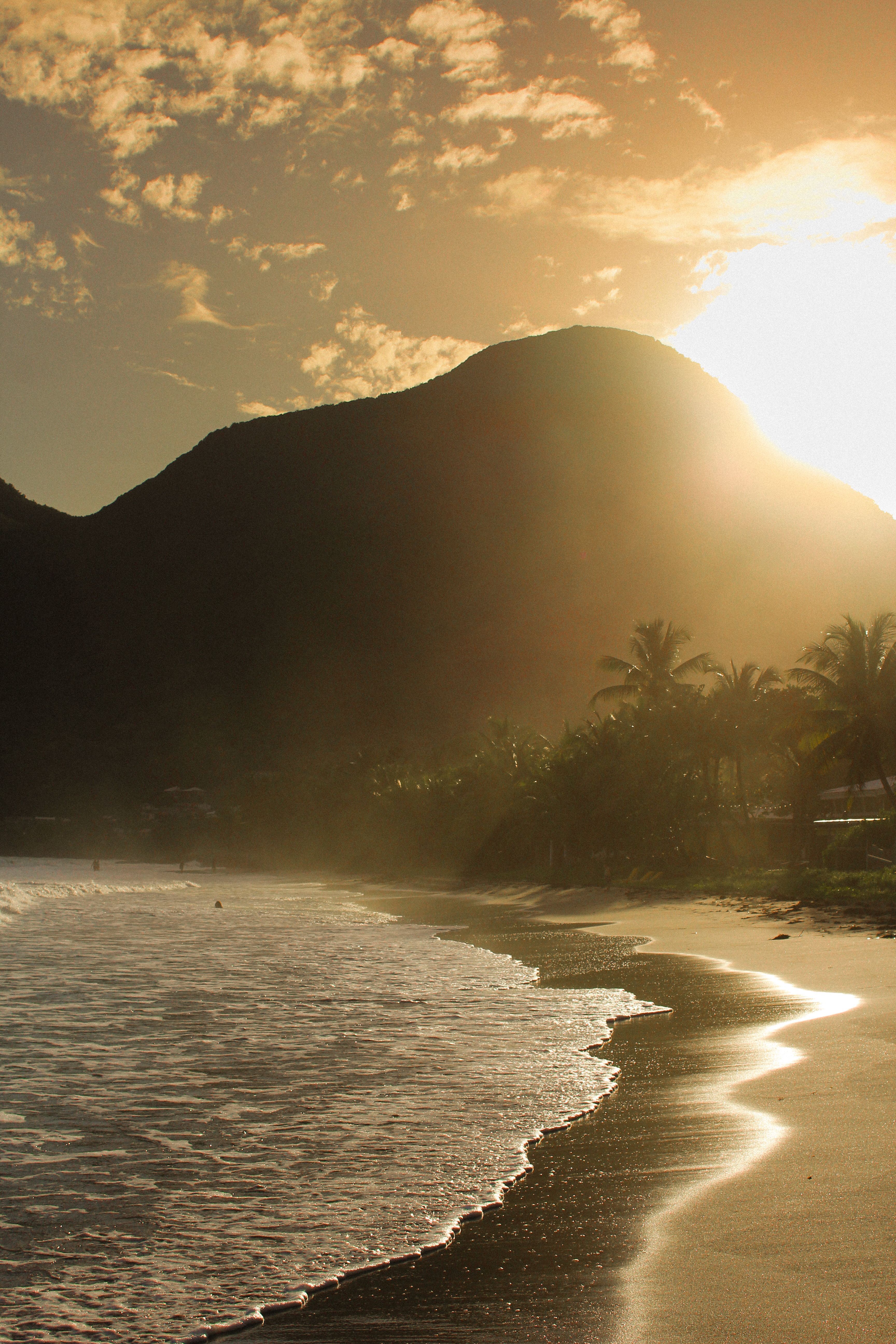 3456x5184 Sunlit Tropical Beach with Mountain Backdrop · Free