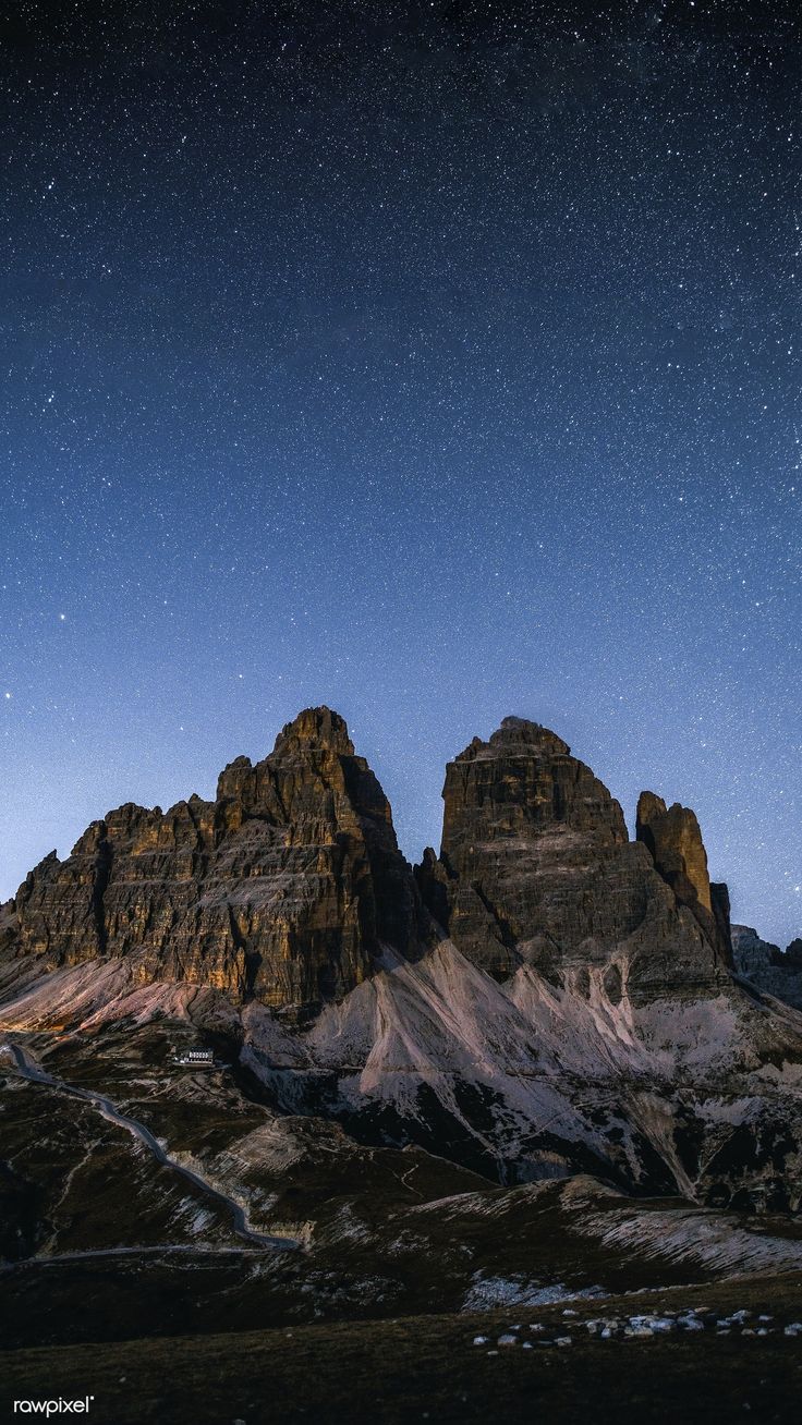 736x1308 Download premium image of Tre Cime di Lavaredo at night in the Dolomites mobile phone wallpaper by Luke Stackpoole about iphone wallpaper dark, iphone wallpaper, iphone wallpaper italy, night view mountain peak