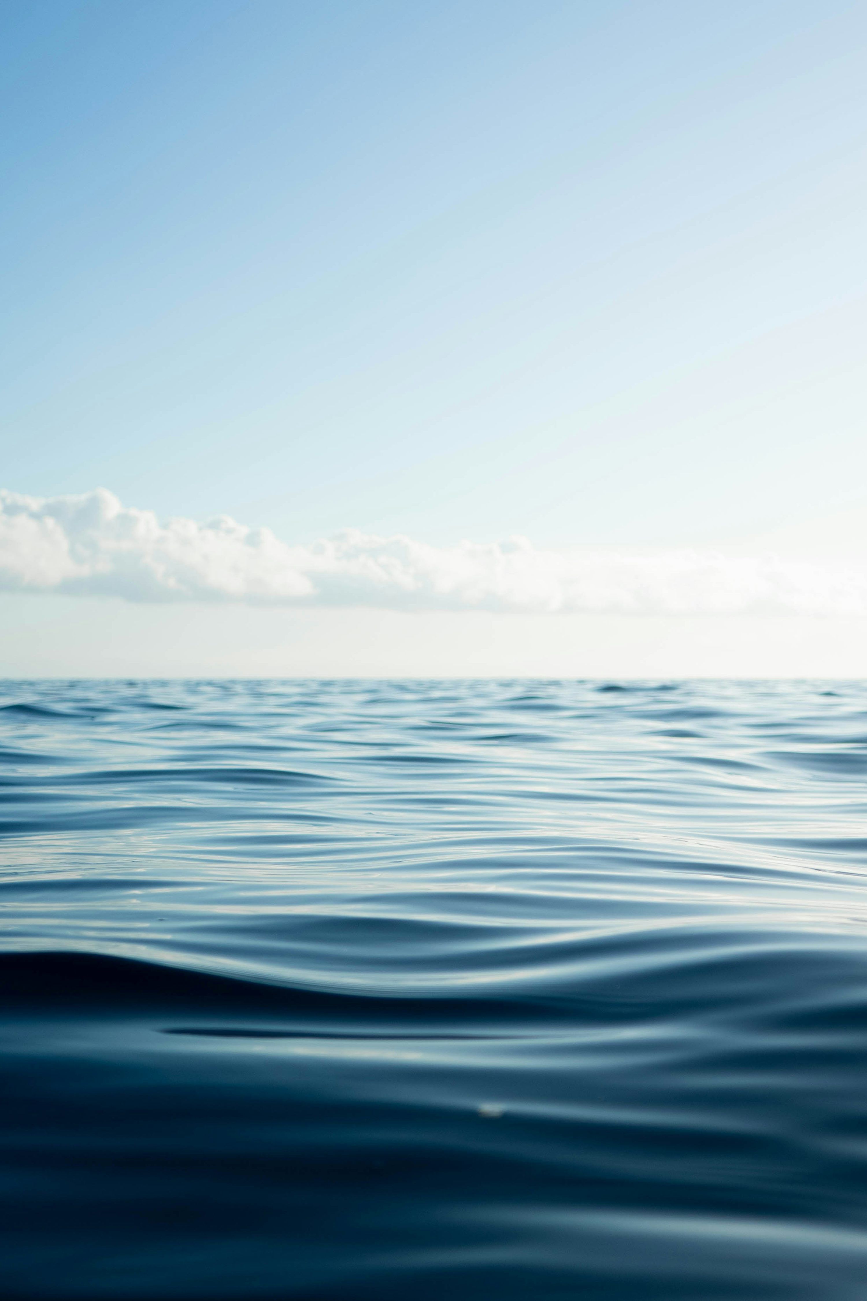 3000x4499 Blue ocean water under blue sky during daytime photo