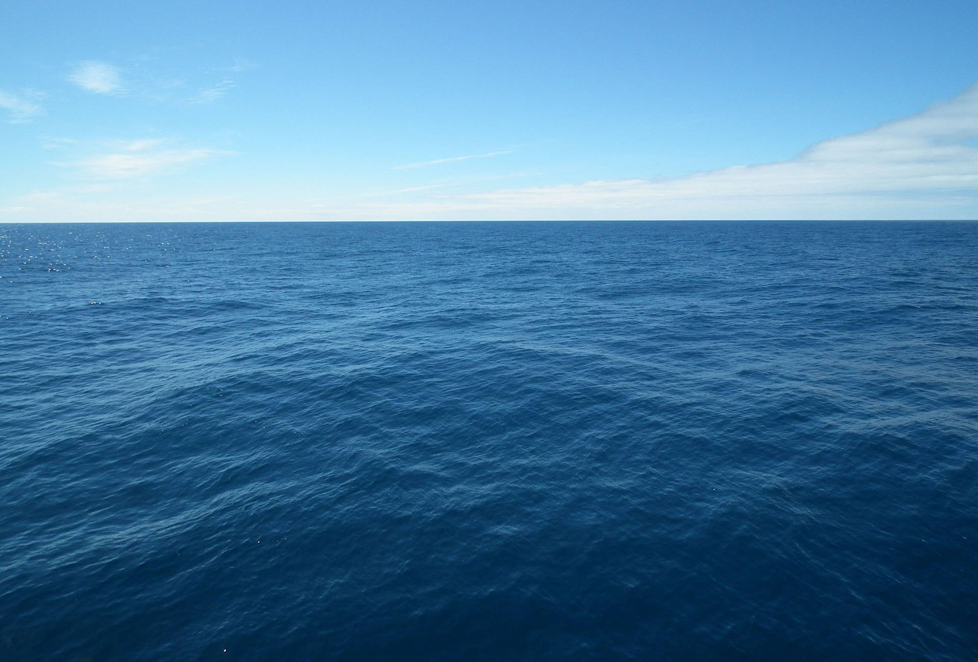 1920x1300 Download Take in a stunning view of the calm ocean horizon. Wallpaper