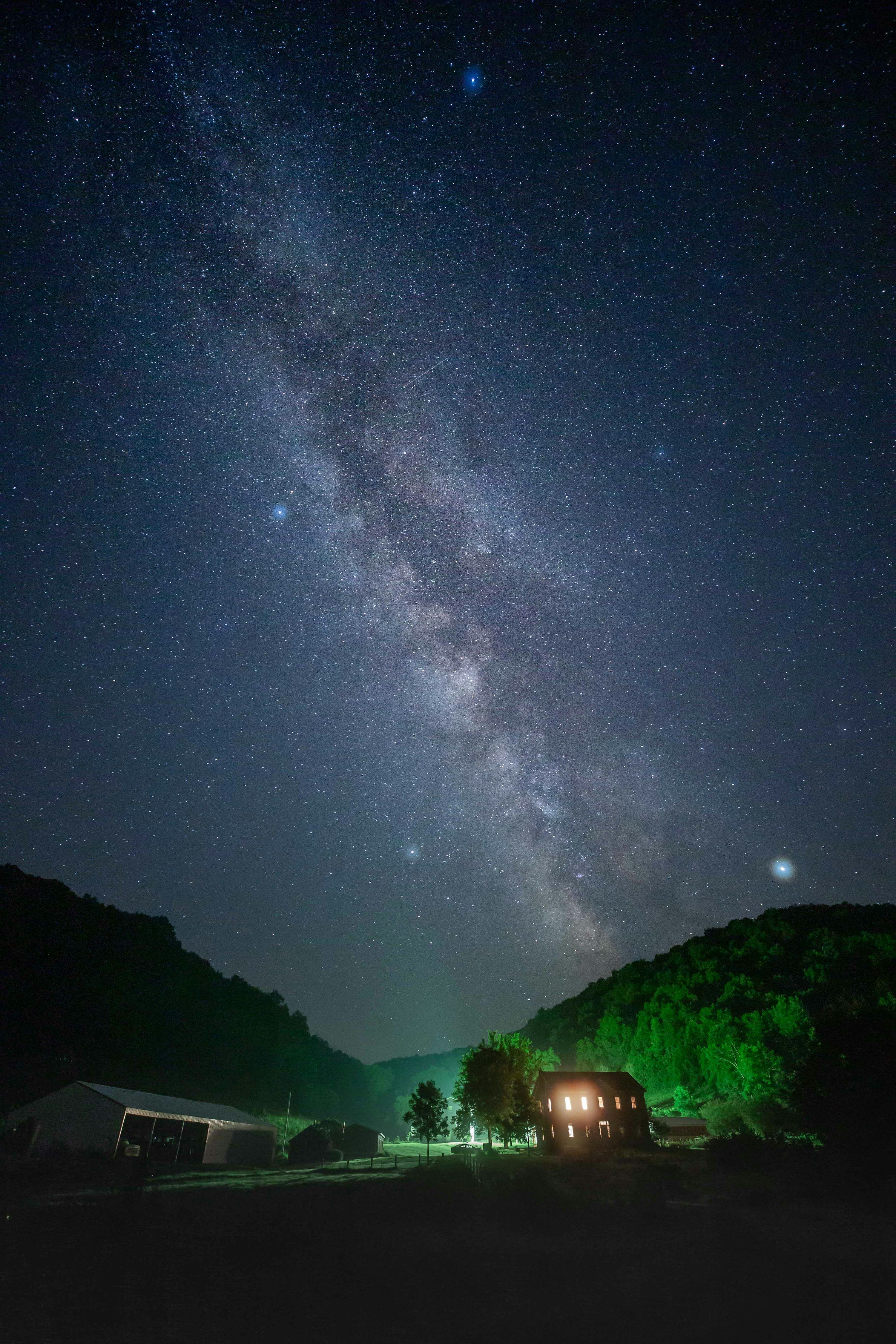 3000x4500 Lighted house in countryside at night photo
