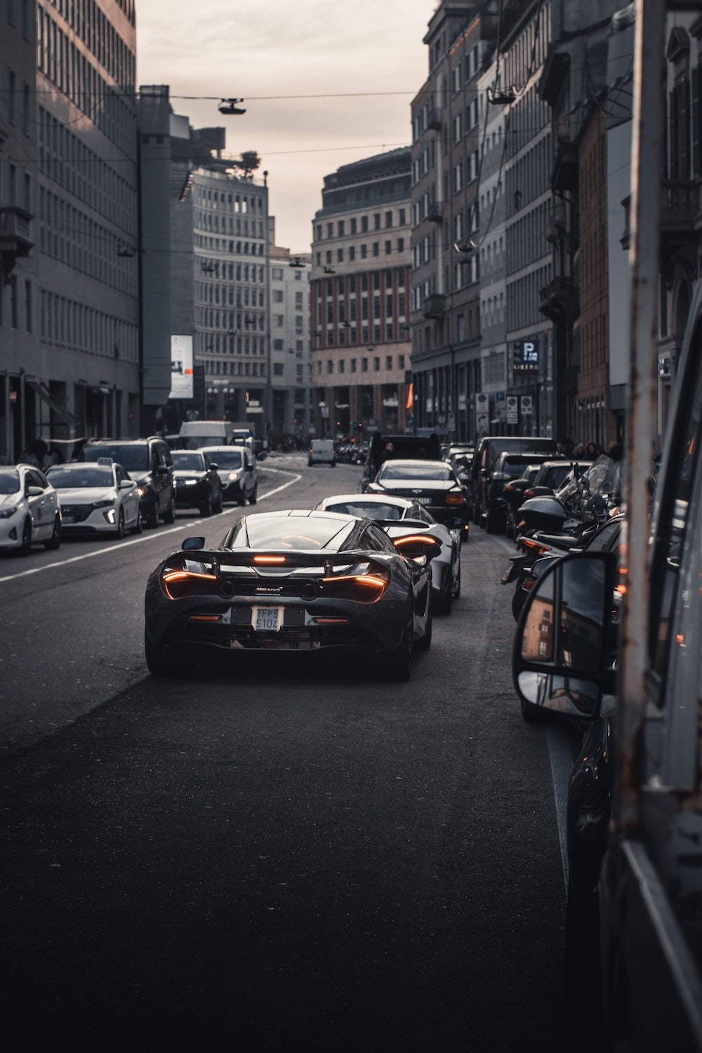 1000x1500 Download McLaren 720S Cars On City Road Phone Wallpaper