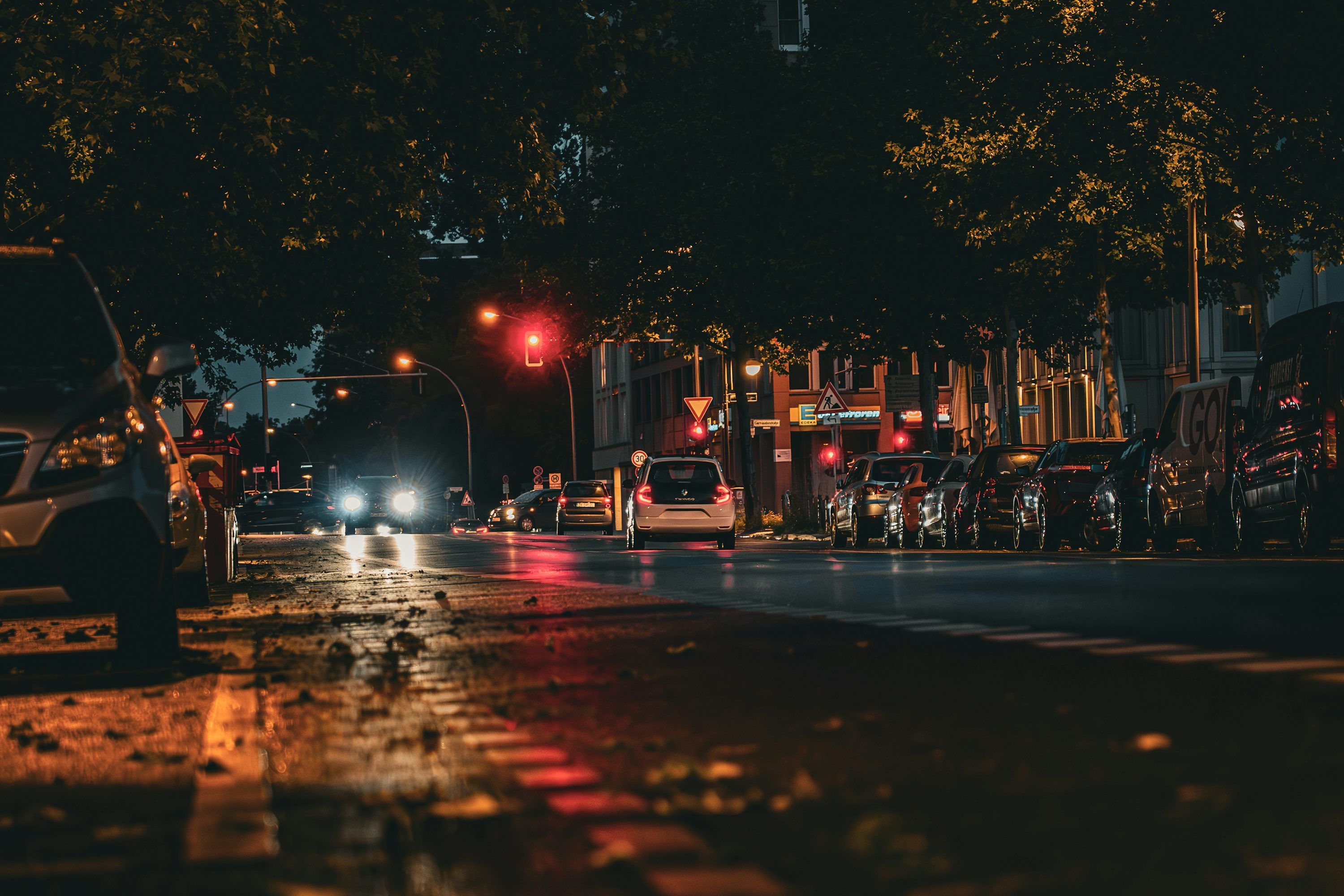 3000x2000 Nighttime street scene with cars and city lights. photo