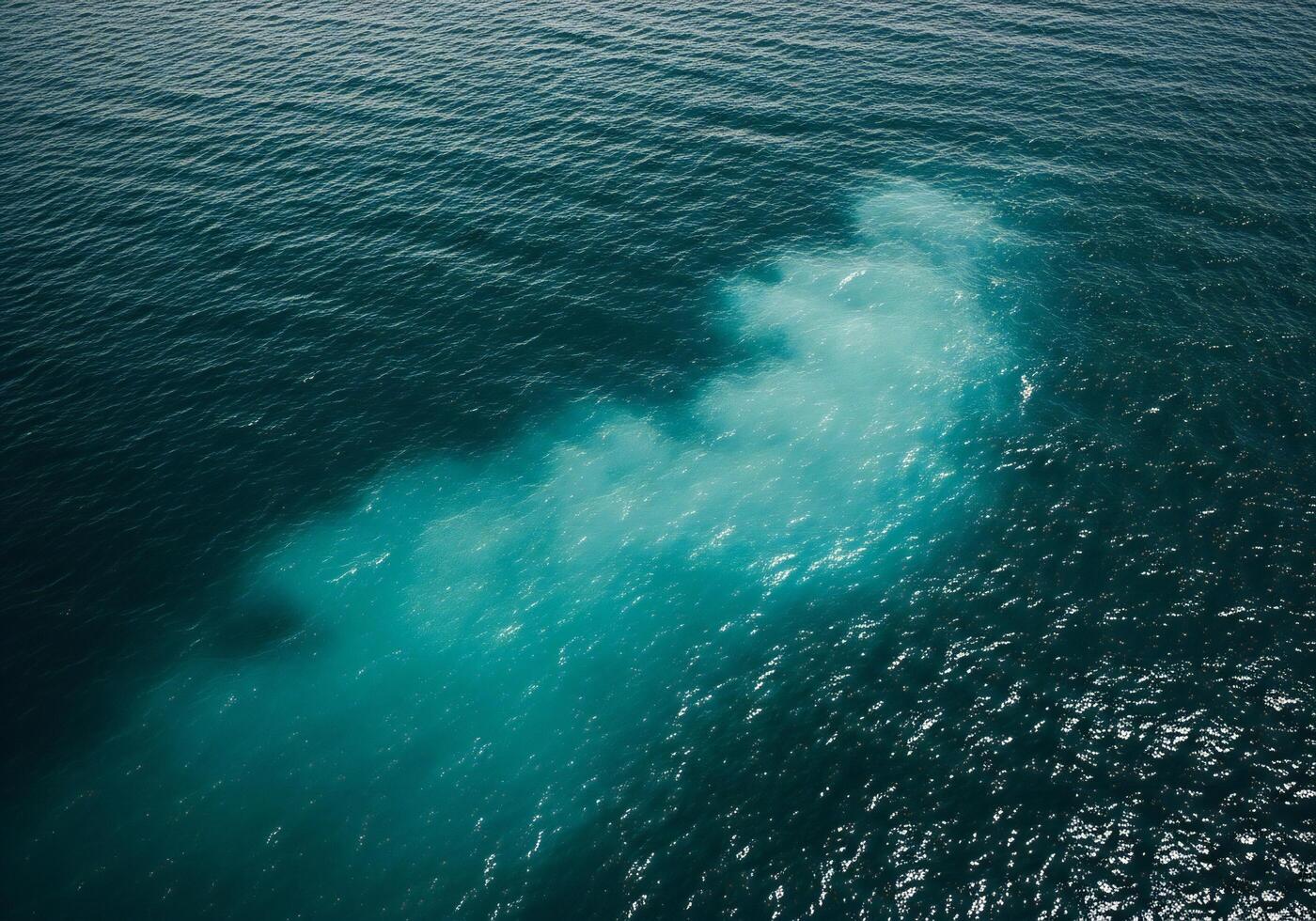 1400x980 Nature background, Nature wallpaper, Aerial view of deep blue ocean water with a vibrant turquoise mixing patch