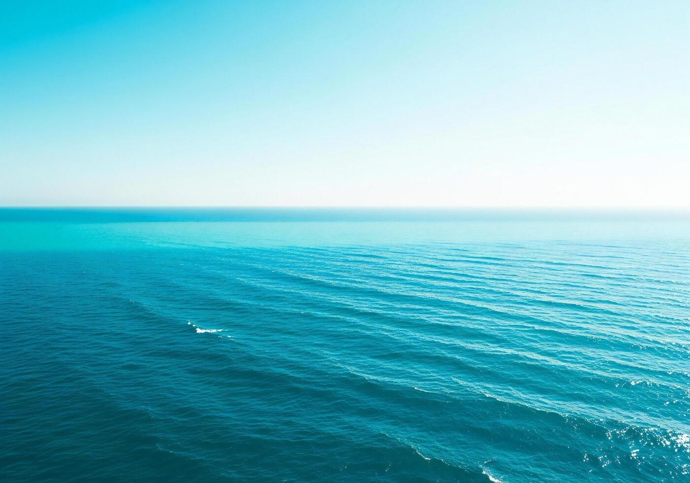 1400x980 Nature background, Nature wallpaper, Vast expanse of deep blue ocean water with gentle waves under a clear bright sky