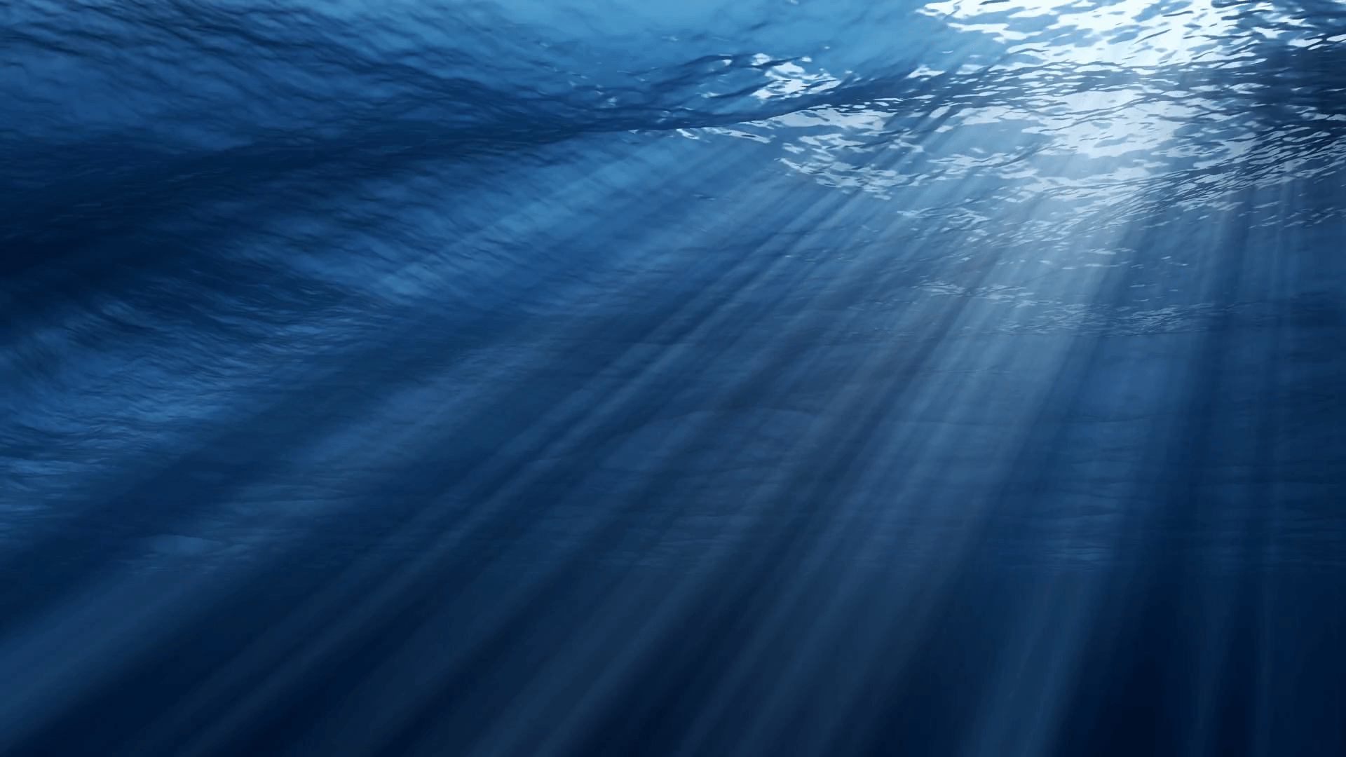 1920x1080 Underwater view of ocean waves in clear blue water. Beautiful aquatic scene with sunbeams and god rays in deep sea. 3D animation with swells and tidal waves