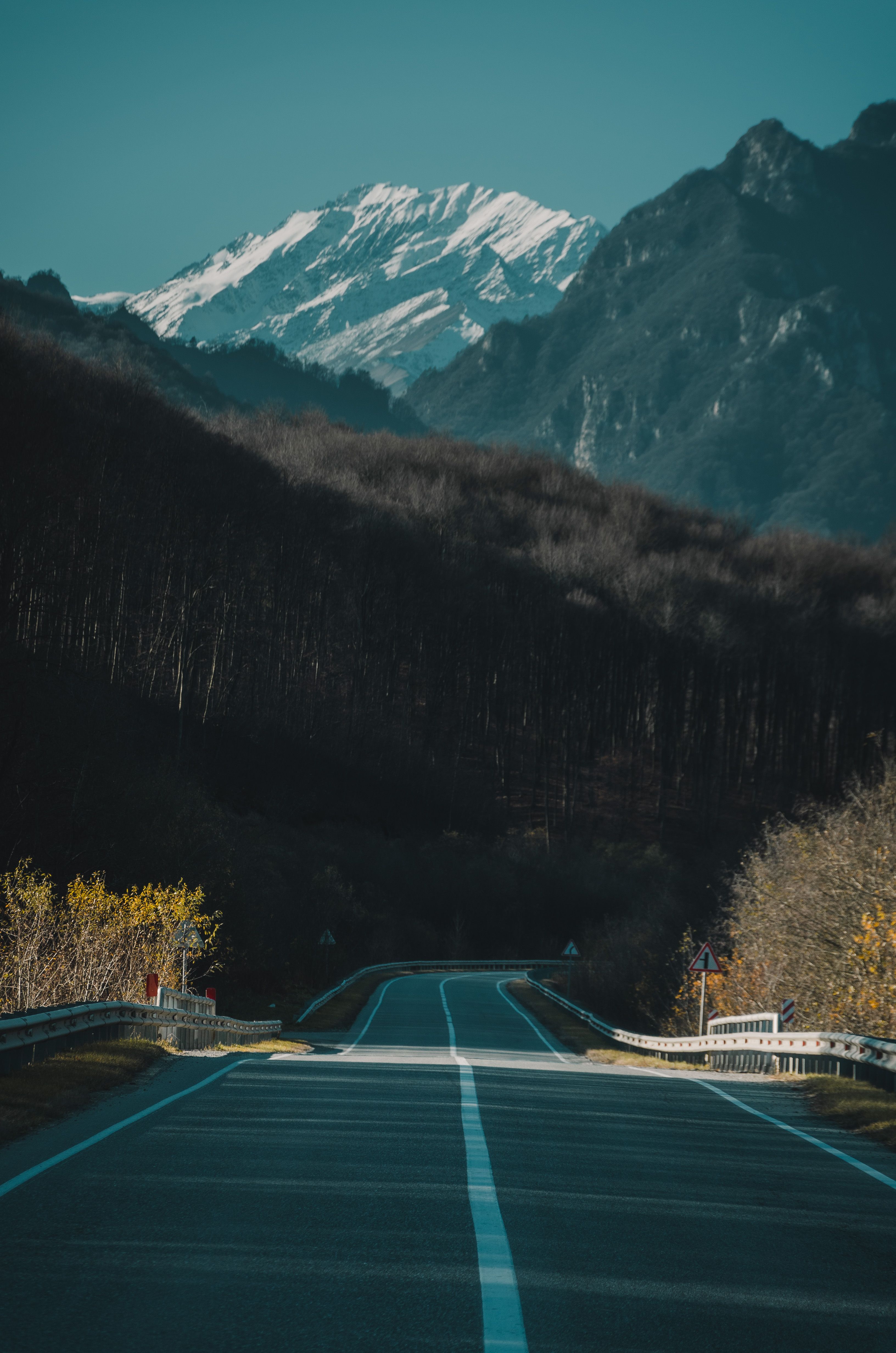 3264x4928 A Concrete Road Near Mountains · Free