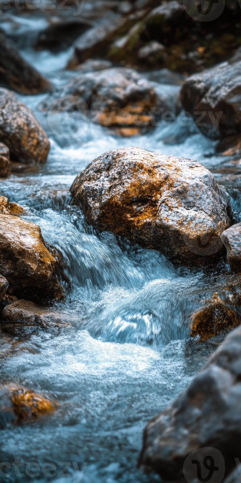 980x1960 Flowing water cascades over smooth stones in a tranquil natural setting for mobile phone wallpaper