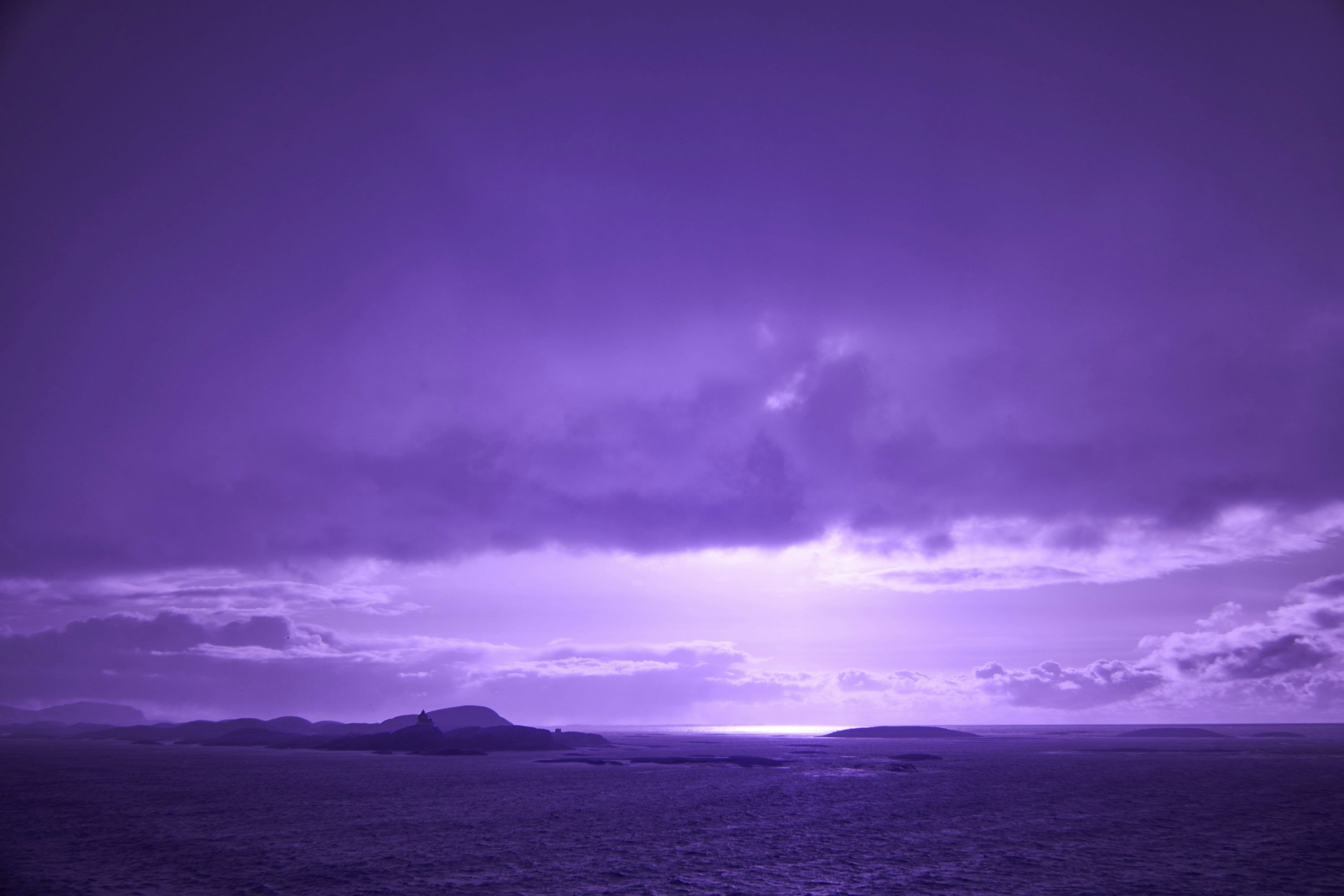 3000x2000 A picture of a purple sky and some clouds photo