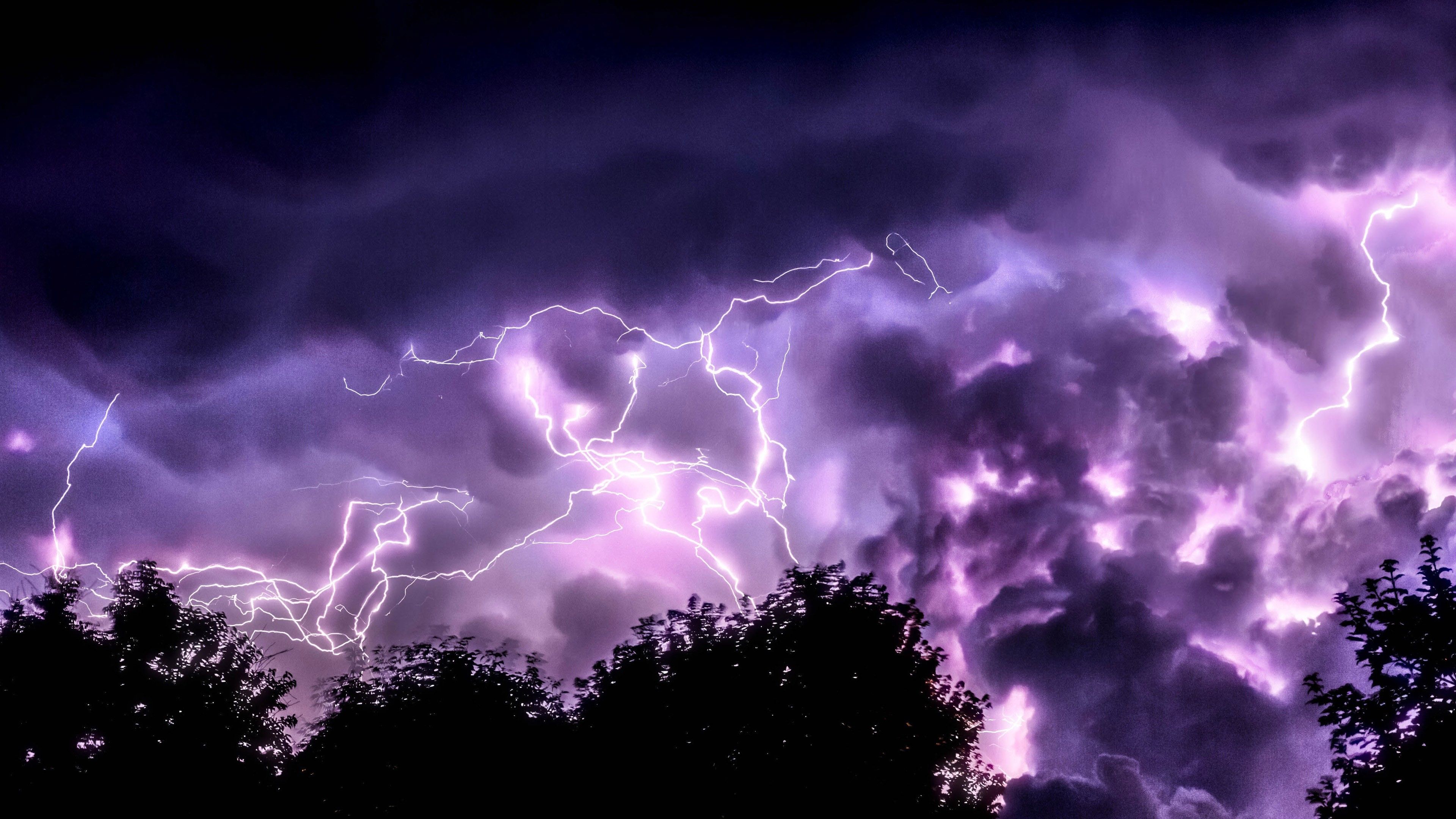 3840x2160 Thunderstorm In Dark Purple Sky Above Trees During Nighttime 4K HD Dark Purple Wallpaper