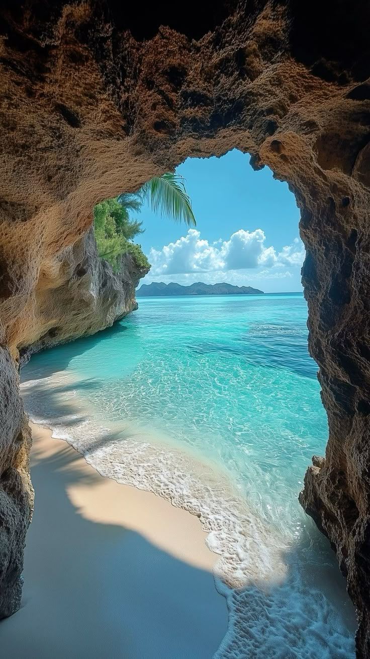 736x1308 Secluded Grotto Beach View Wallpaper. Serene Ocean Bliss for Mobile 4K Quality