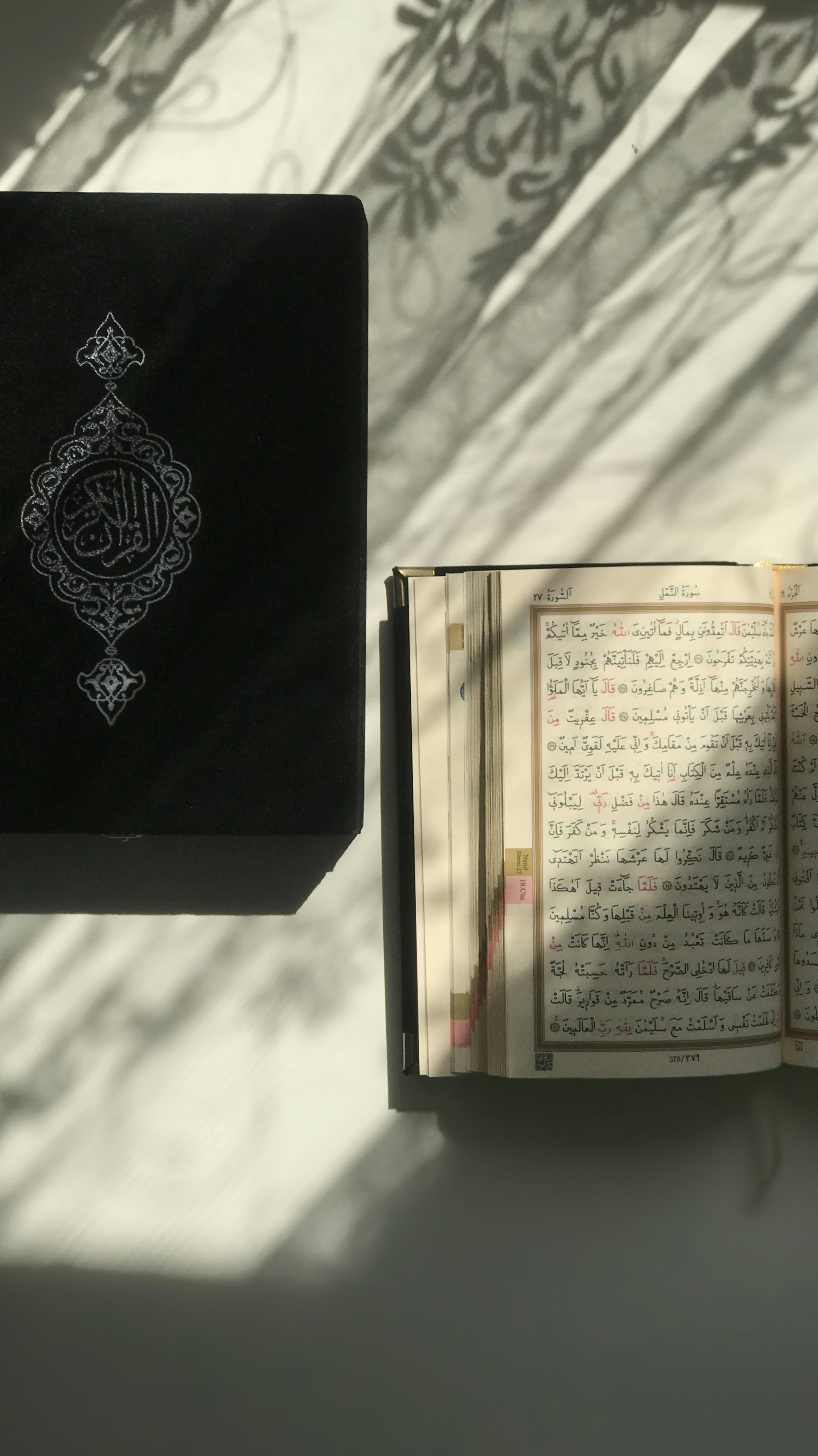 3000x5336 An open book sitting on top of a table photo