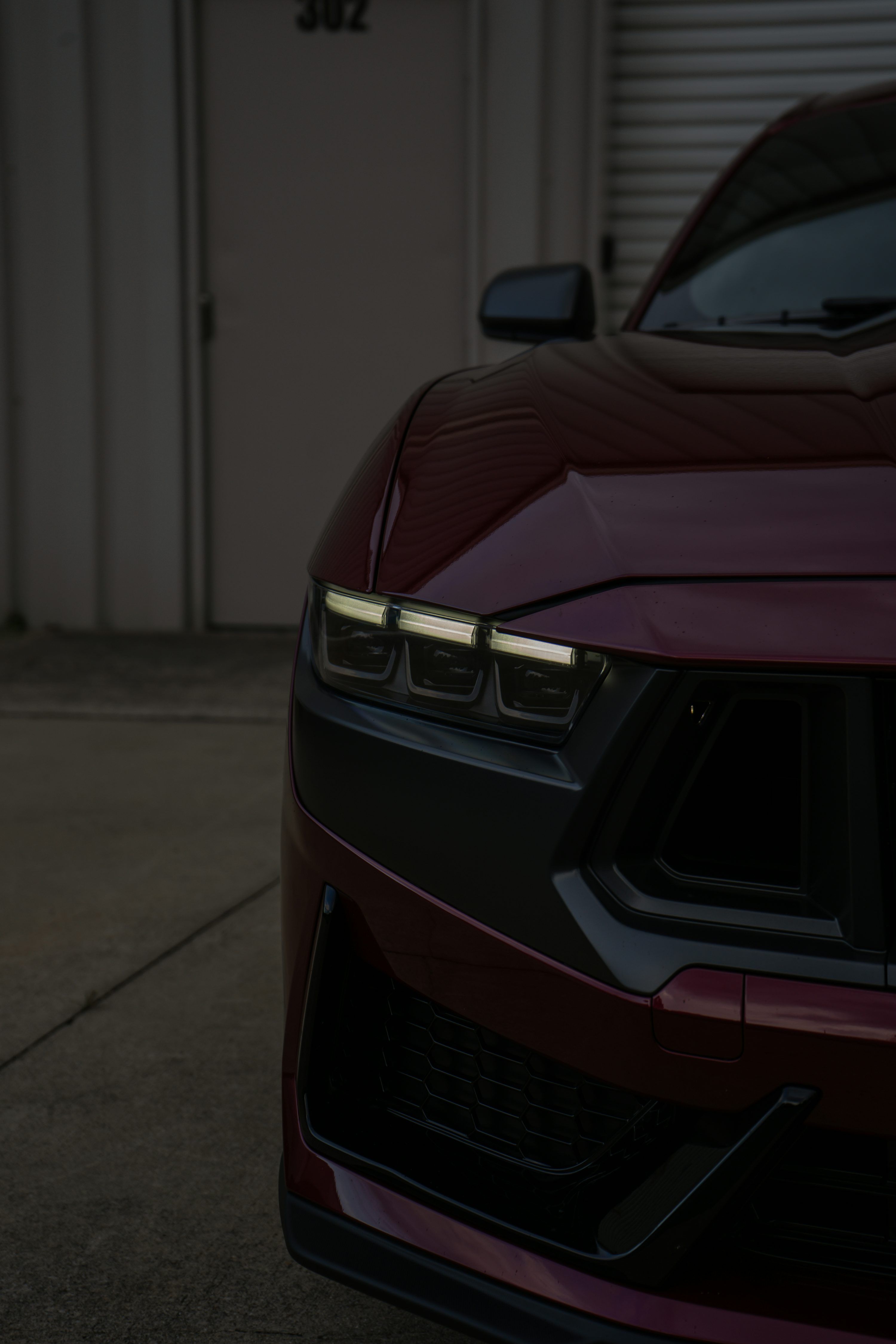 3000x4500 Close Up Of A Dark Red Car's Front Photo