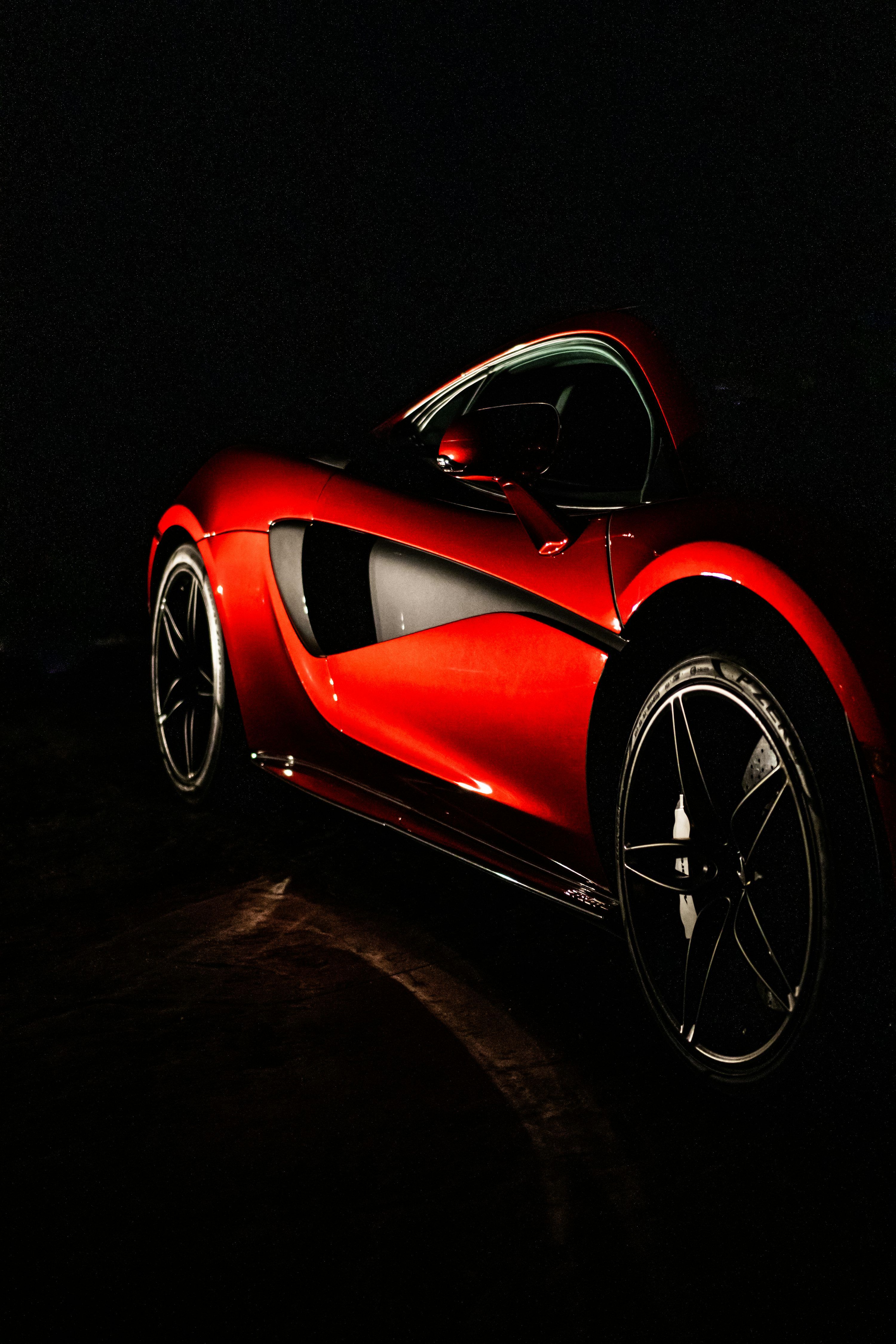 3000x4500 Red ferrari 458 italia on black background photo