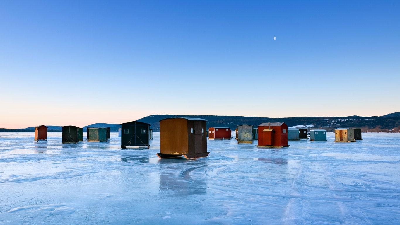 1366x768 Ice fishing huts on frozen lake in New York State, USA