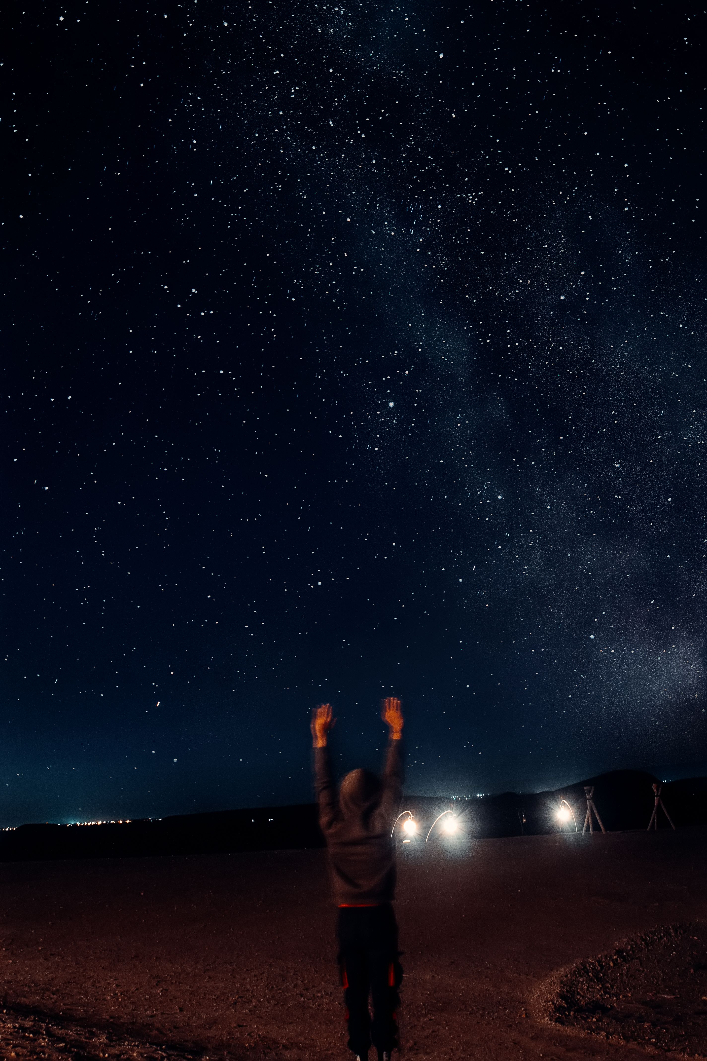 2848x4272 Person Standing with Arms Raised under Night Sky with Stars · Free