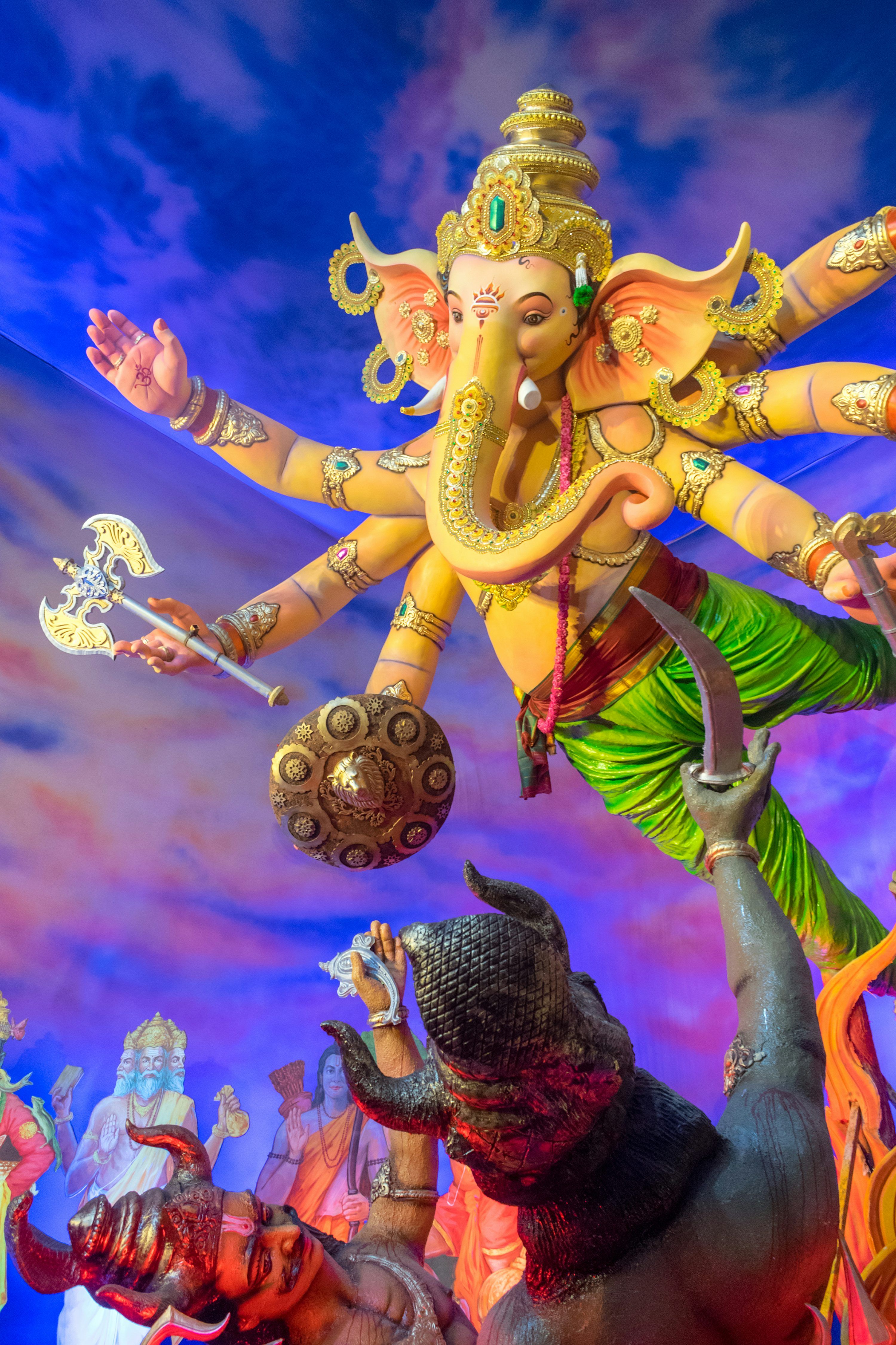 3000x4501 Ganesha deity in dynamic pose with multiple arms. photo