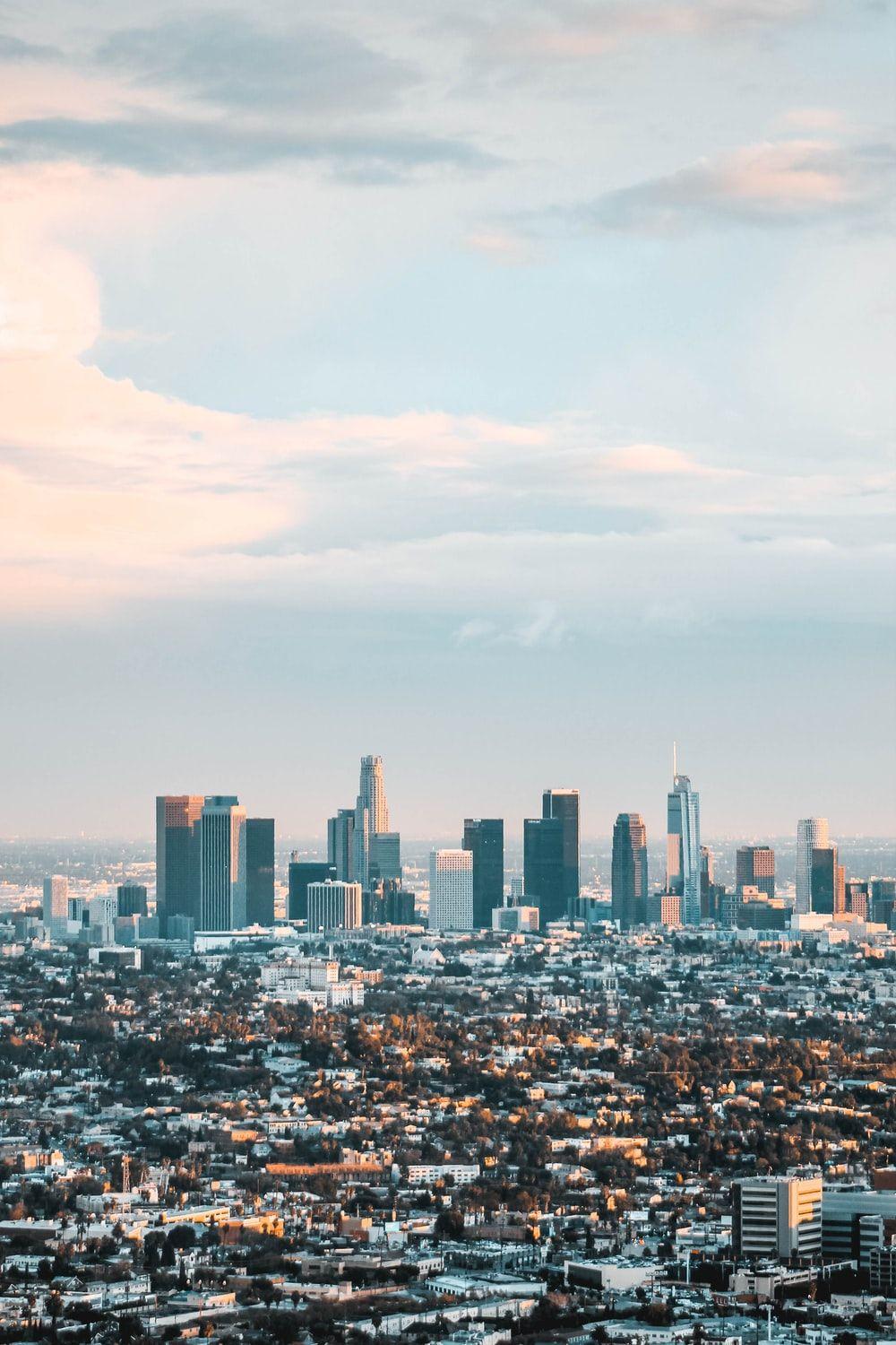 1000x1500 cityscape under white cloud and blue sky during datyiem photo