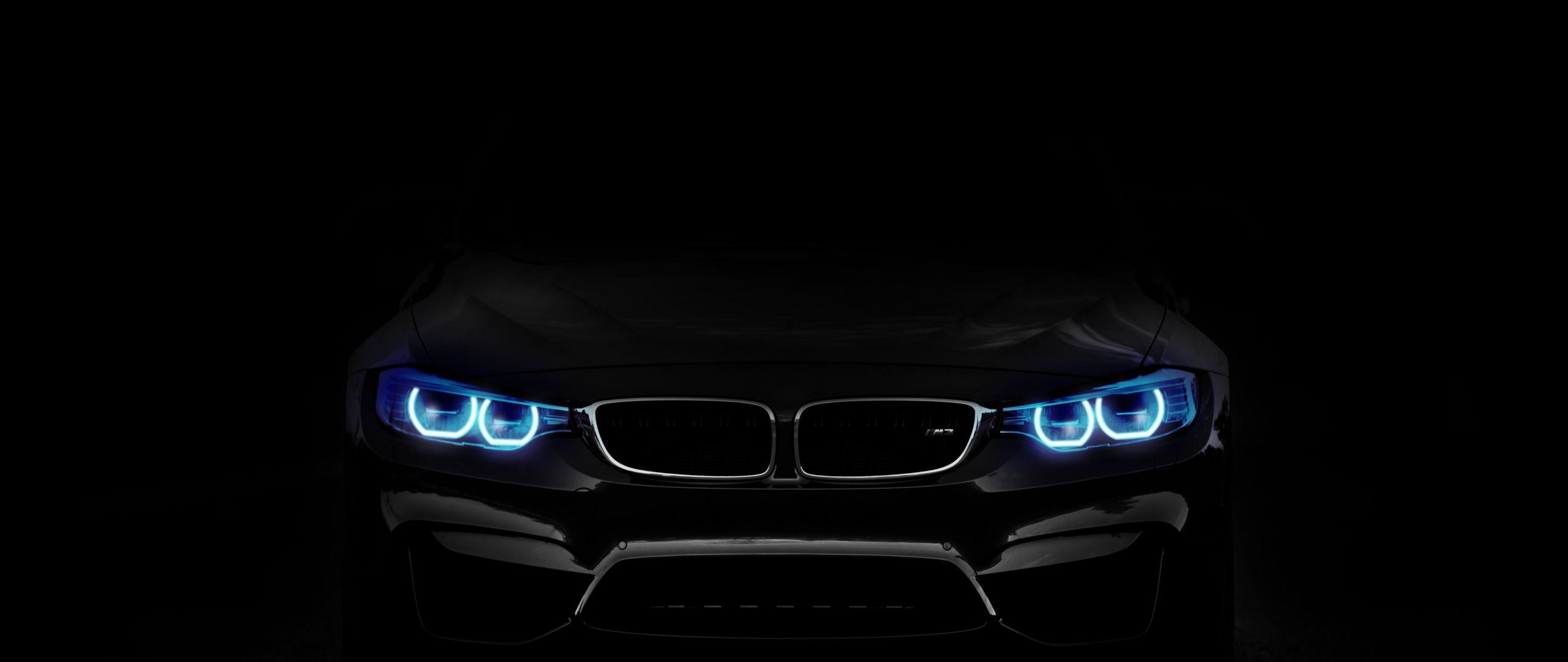 2560x1080 Download 2560x1080 wallpaper bmw, car, blue headlight, dark, dual