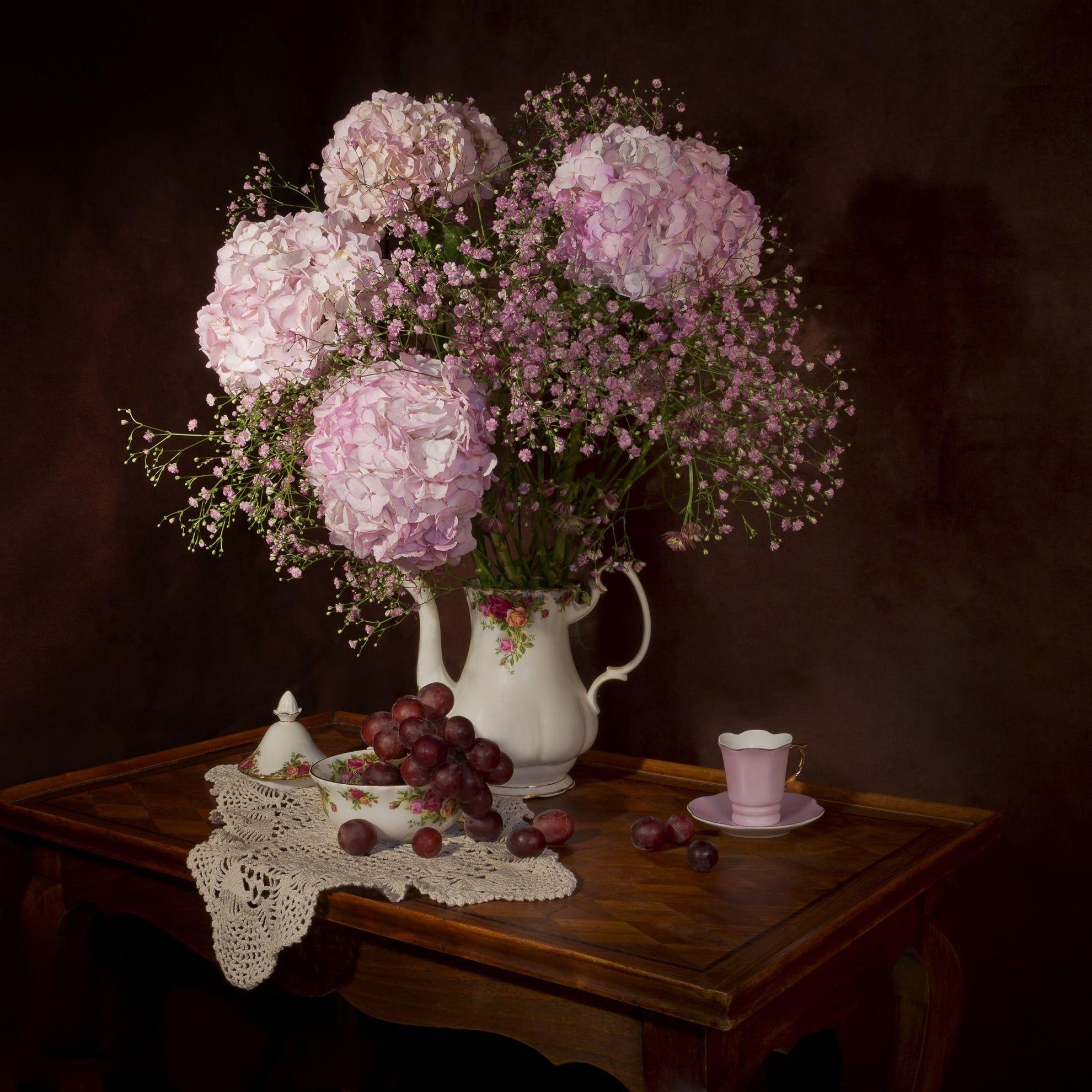1980x1980 Pink Hydrangea and Baby's Breath centerpiece beside grapes