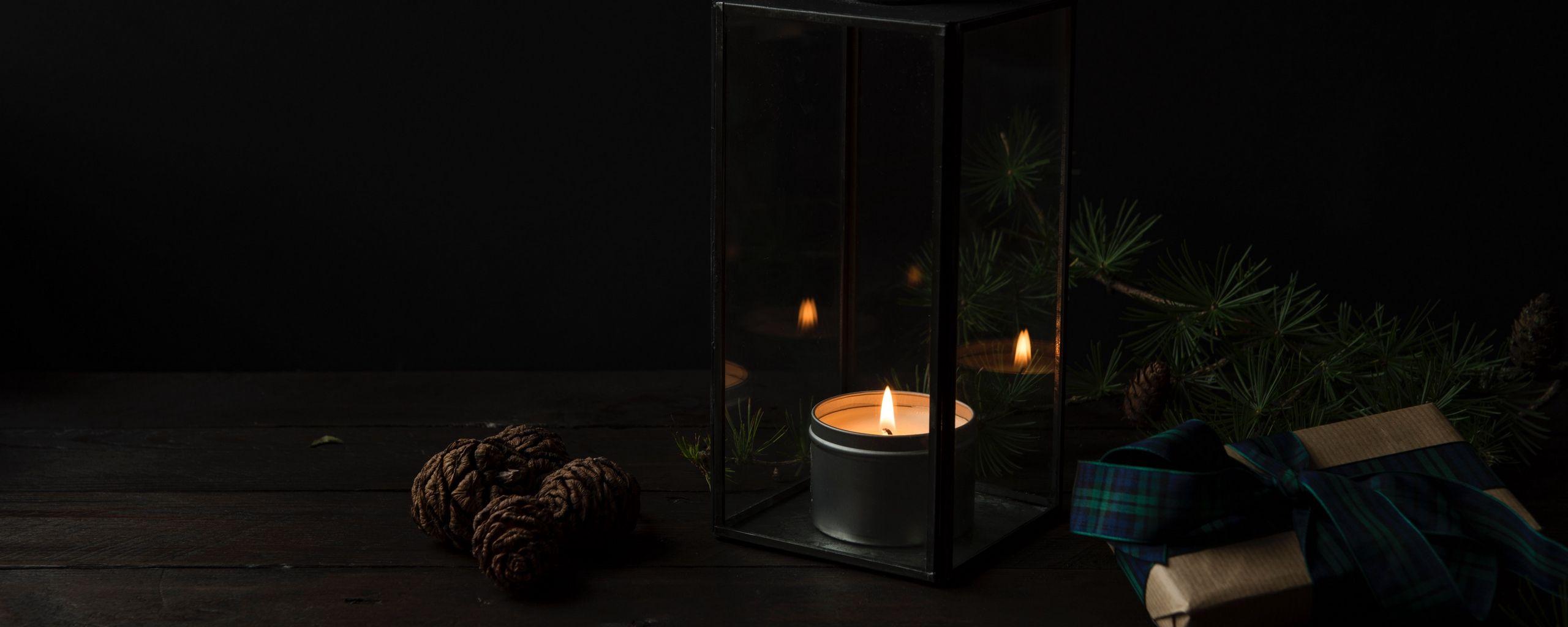 2560x1024 Download wallpaper 2560x1024 candlestick, candle, gifts, dark