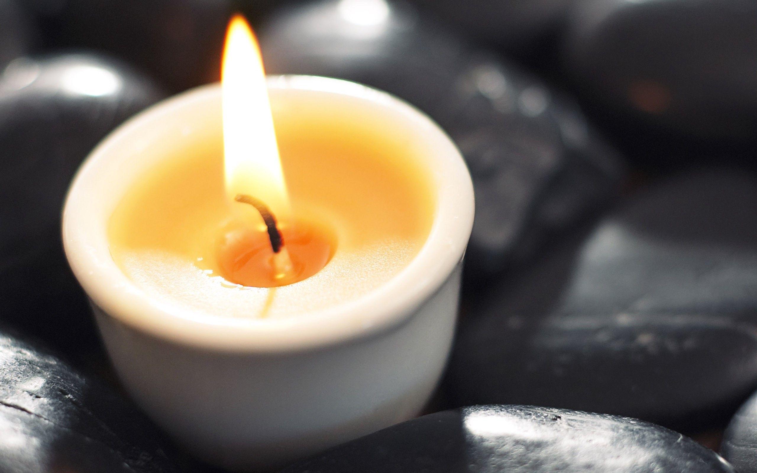 2560x1600 Download wallpaper 2560x1600 candlestick, candle, flame, stone HD