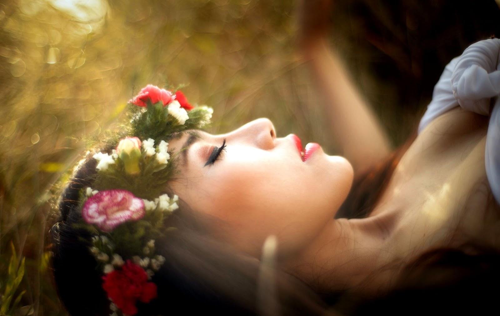 1600x1011 Female Lying Flowers Wallpaper