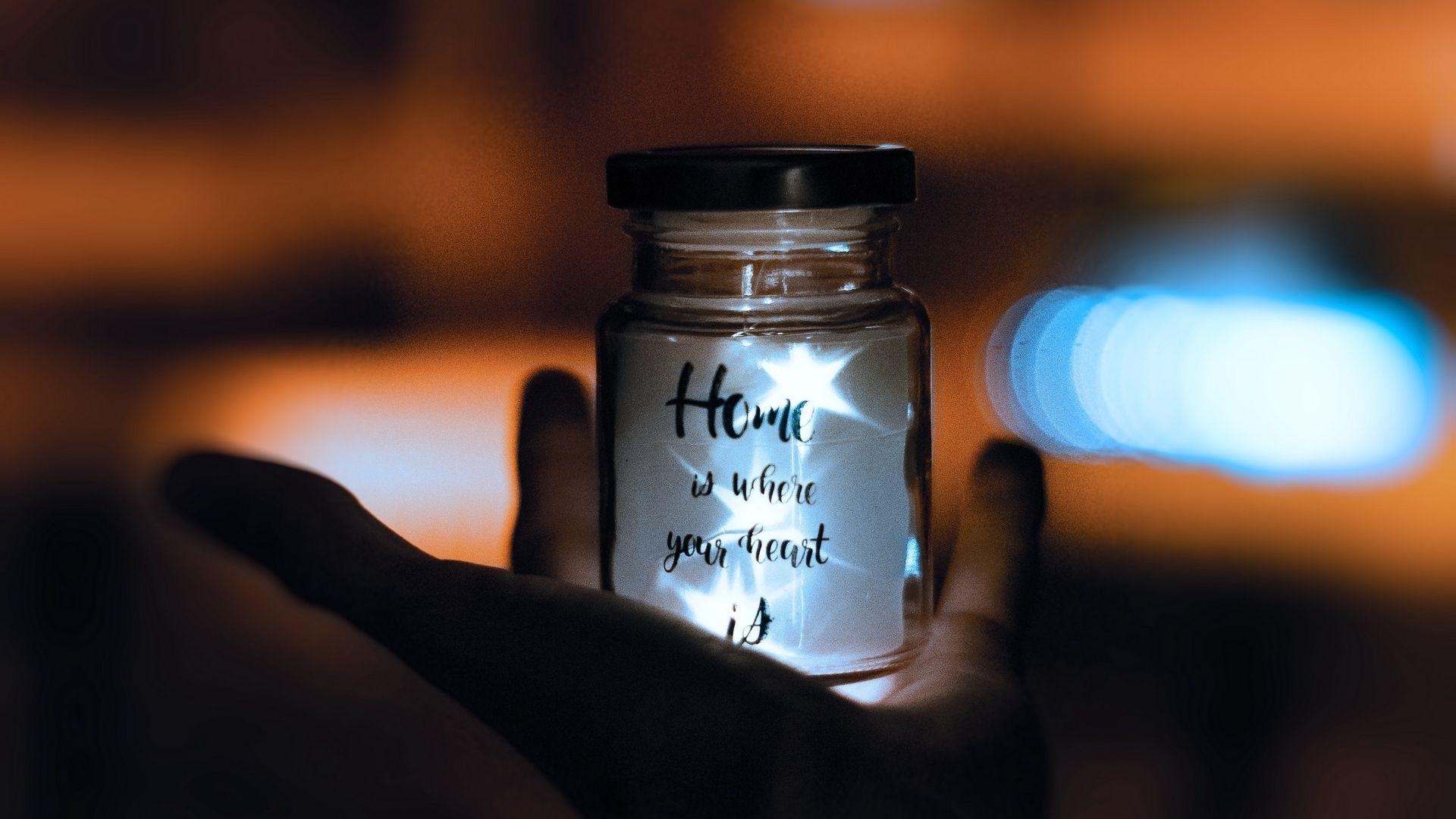 1920x1080 Download wallpaper 1920x1080 bottle, inscription, hand, blur