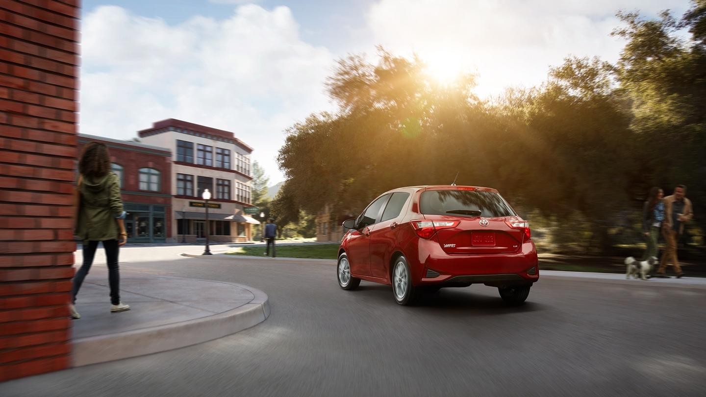 1440x810 Toyota Yaris red color back side on road HD wallpaper and image