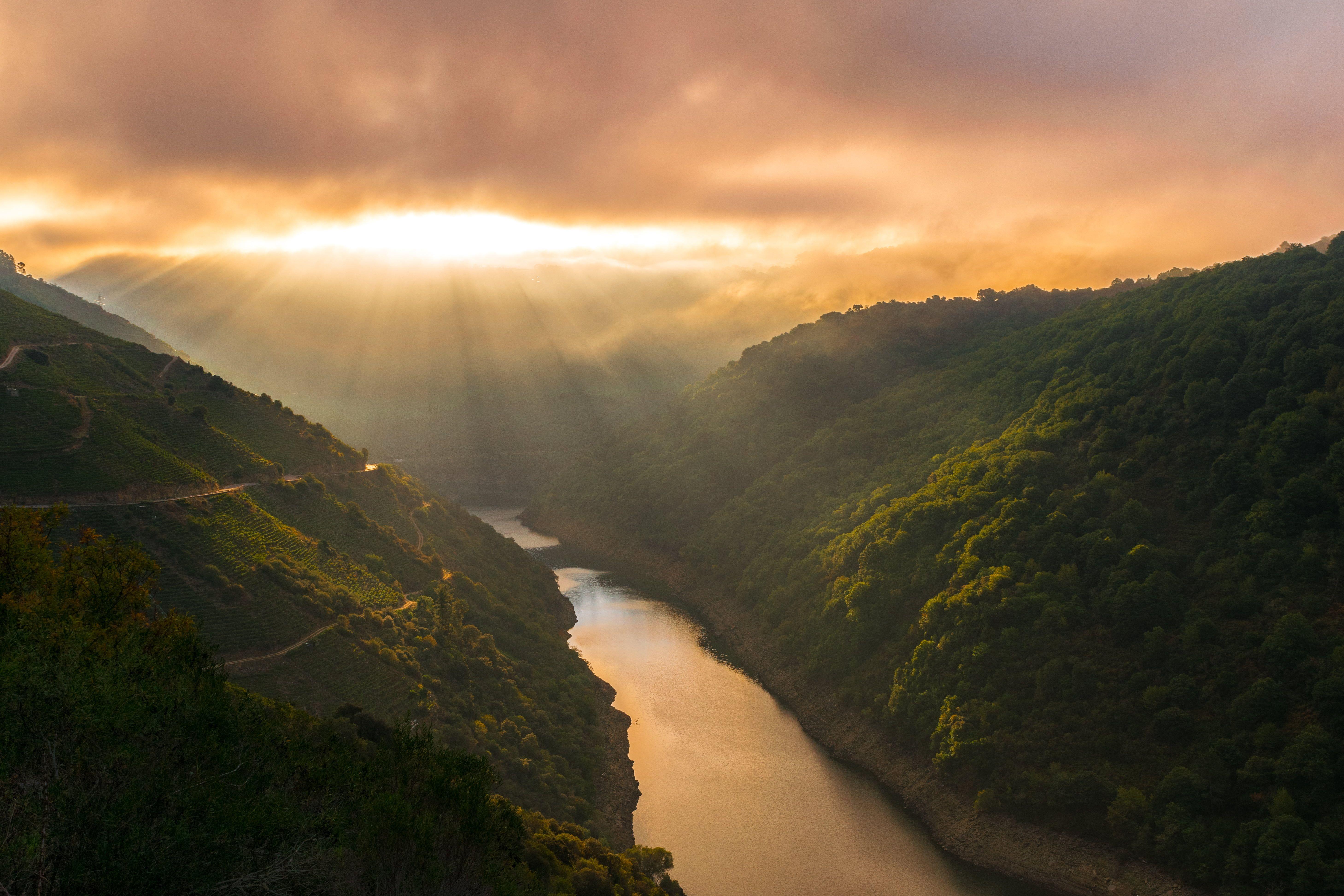 5835x3890 Flowing river with green forest mountain hills at during sunset