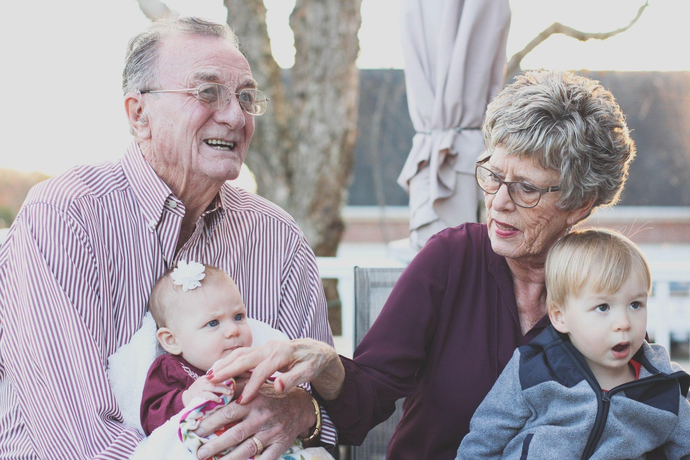 2304x1536 Grandmother and Grandfather Holding Child on Their Lap · Free